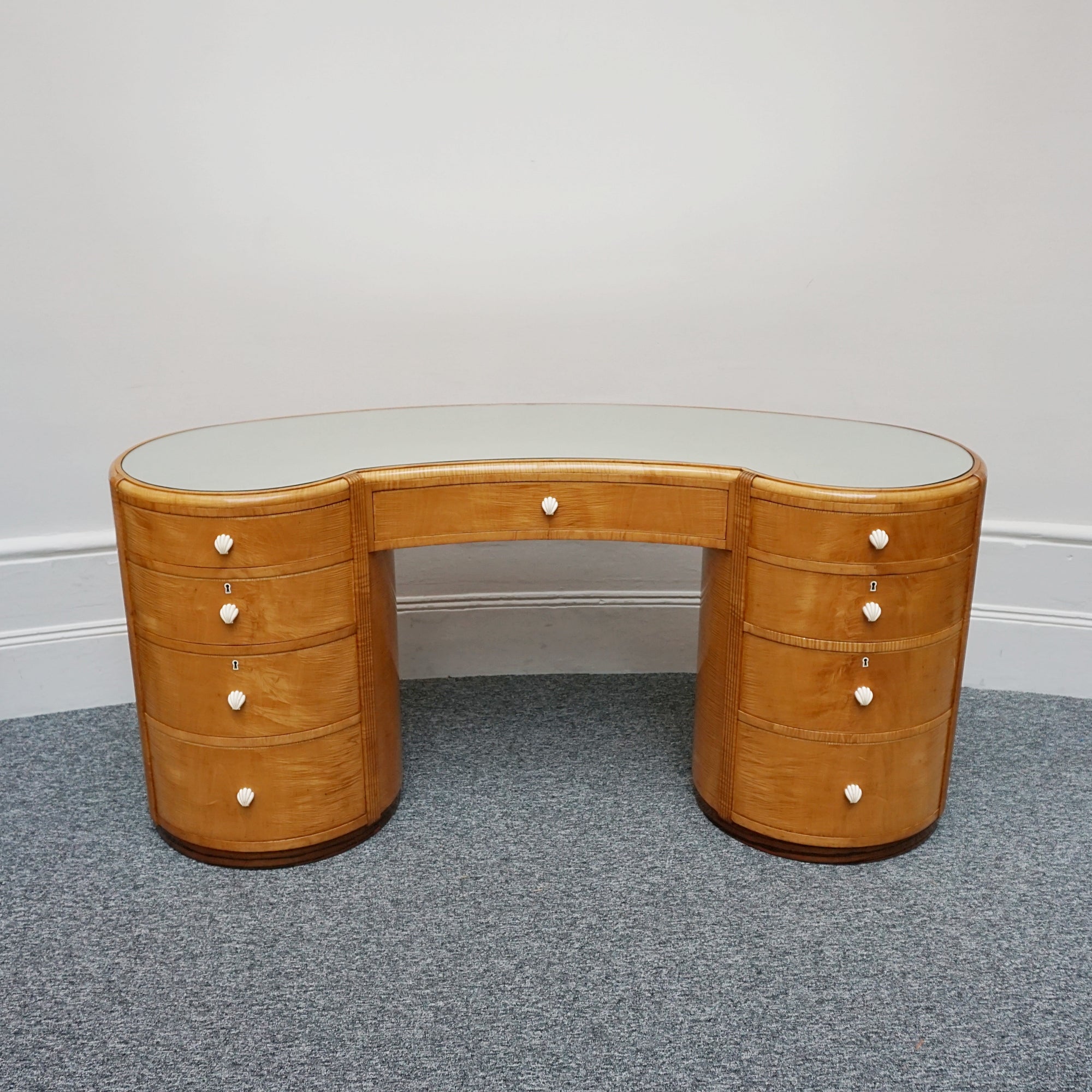 An Art Deco Desk by Betty Joel. Satin birch veneered with macassar ebony banding to base. Glass mirrored top with original ivory hand carved shell handles. 1930 dressing table, art deco desk - Jeroen Markies Art Deco