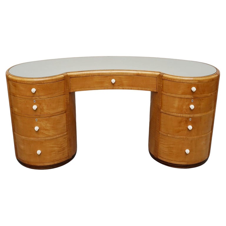 An Art Deco Desk by Betty Joel. Satin birch veneered with macassar ebony banding to base. Glass mirrored top with original ivory hand carved shell handles. 1930 dressing table, art deco desk - Jeroen Markies Art Deco