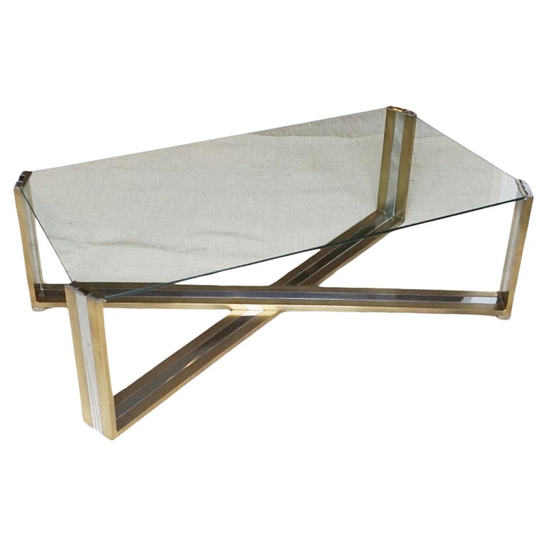 A Mid-Century coffee table designed by Romeo Rega. Brass and chrome X-frame base with inset glass top - Jereon Markies Art Deco