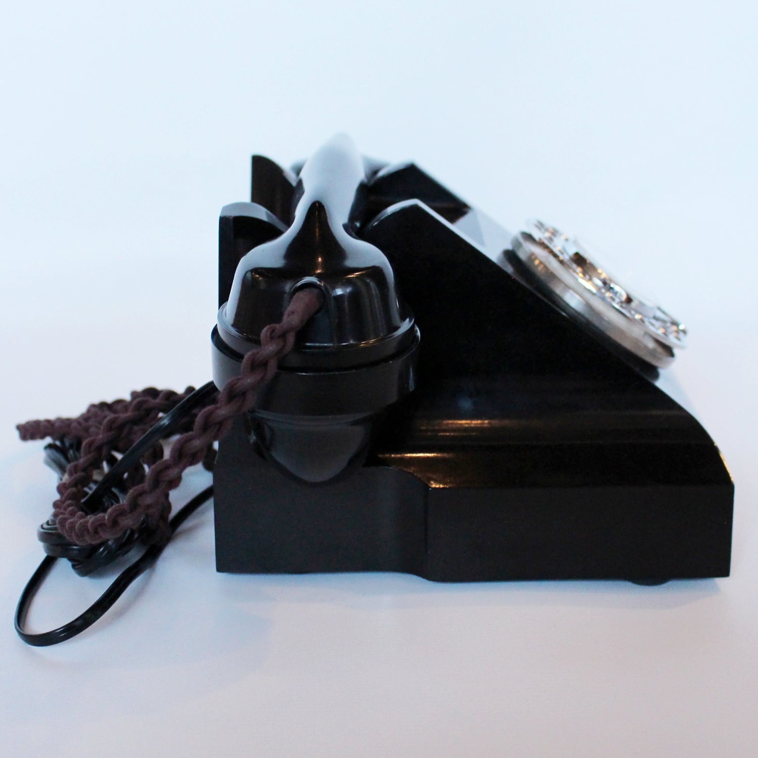 An original GPO telephone in black bakelite. With integral drawer.