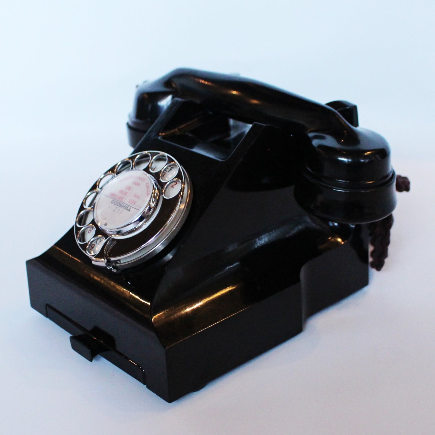 An original GPO telephone in black bakelite. With integral drawer.