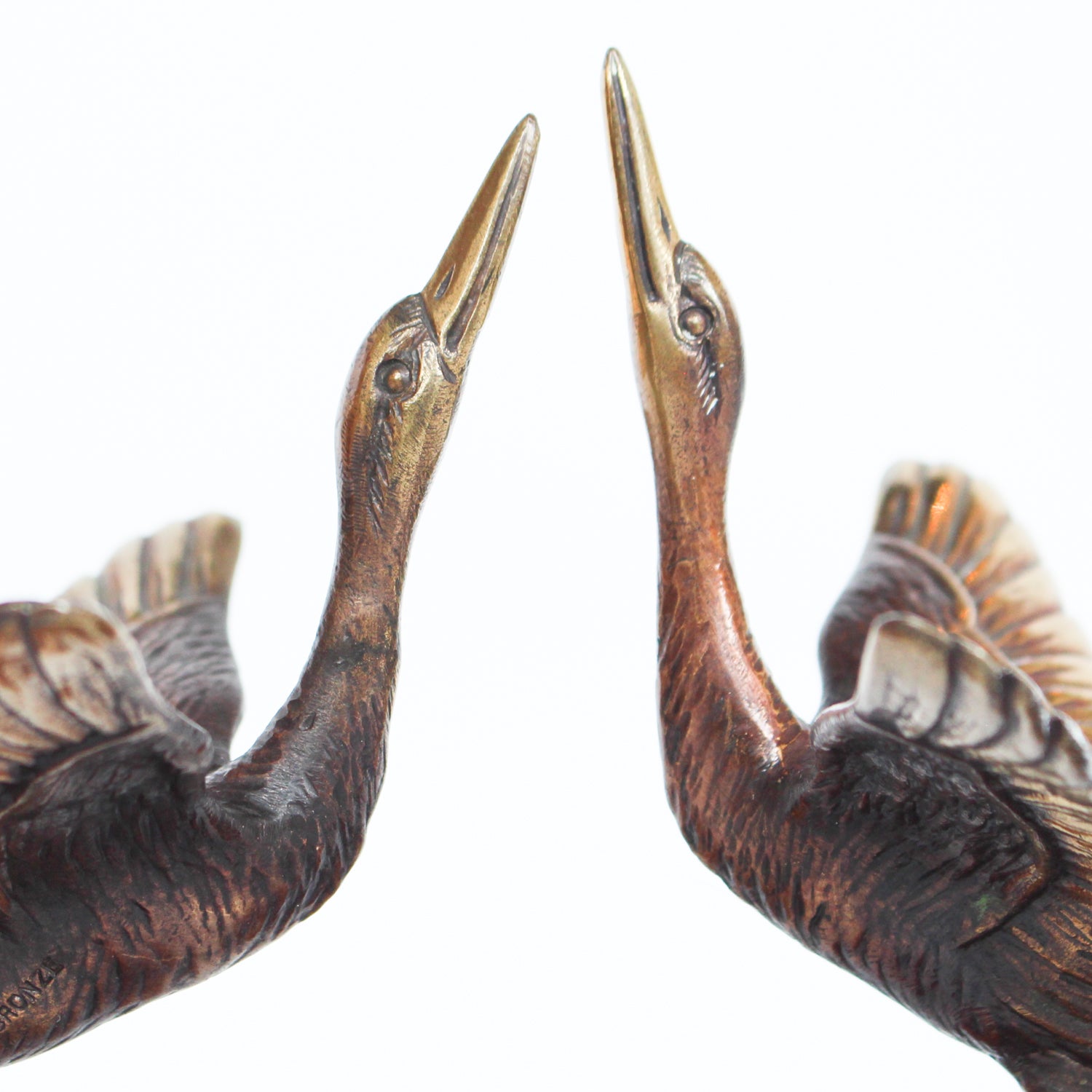 A pair of Art Deco, bronze bookends in the form of two marabou storks. Set over marble plinths.