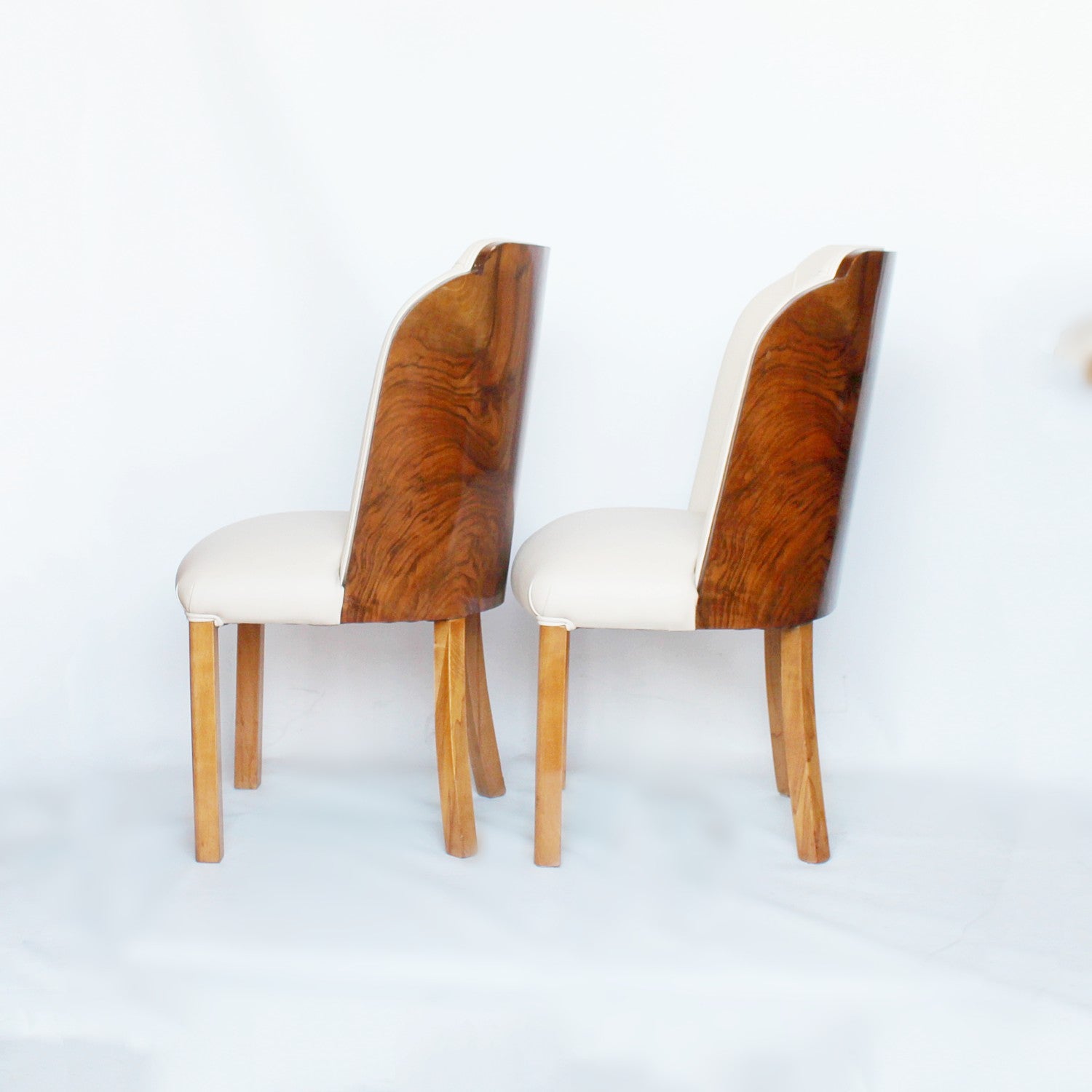 A pair of walnut backed, Art Deco cloud chairs by Harry & Lou Epstein at Jeroen Markies