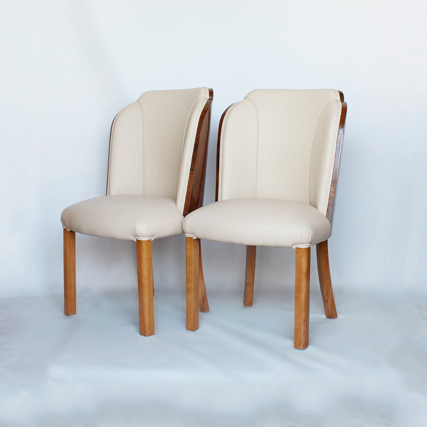A pair of walnut backed, Art Deco cloud chairs by Harry & Lou Epstein at Jeroen Markies