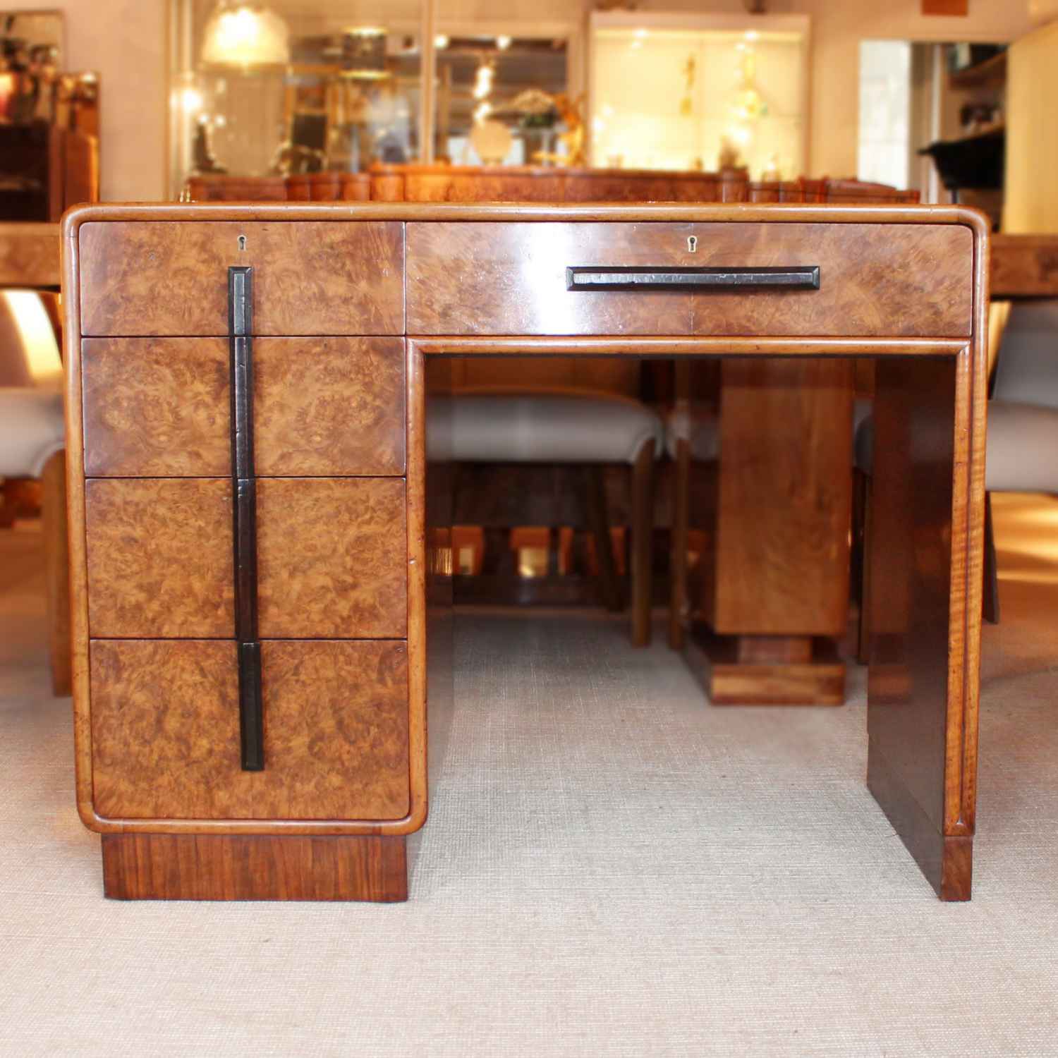 Art deco writing desk by Hamptons of London in burr walnut with leather top at Jeroen Markies
