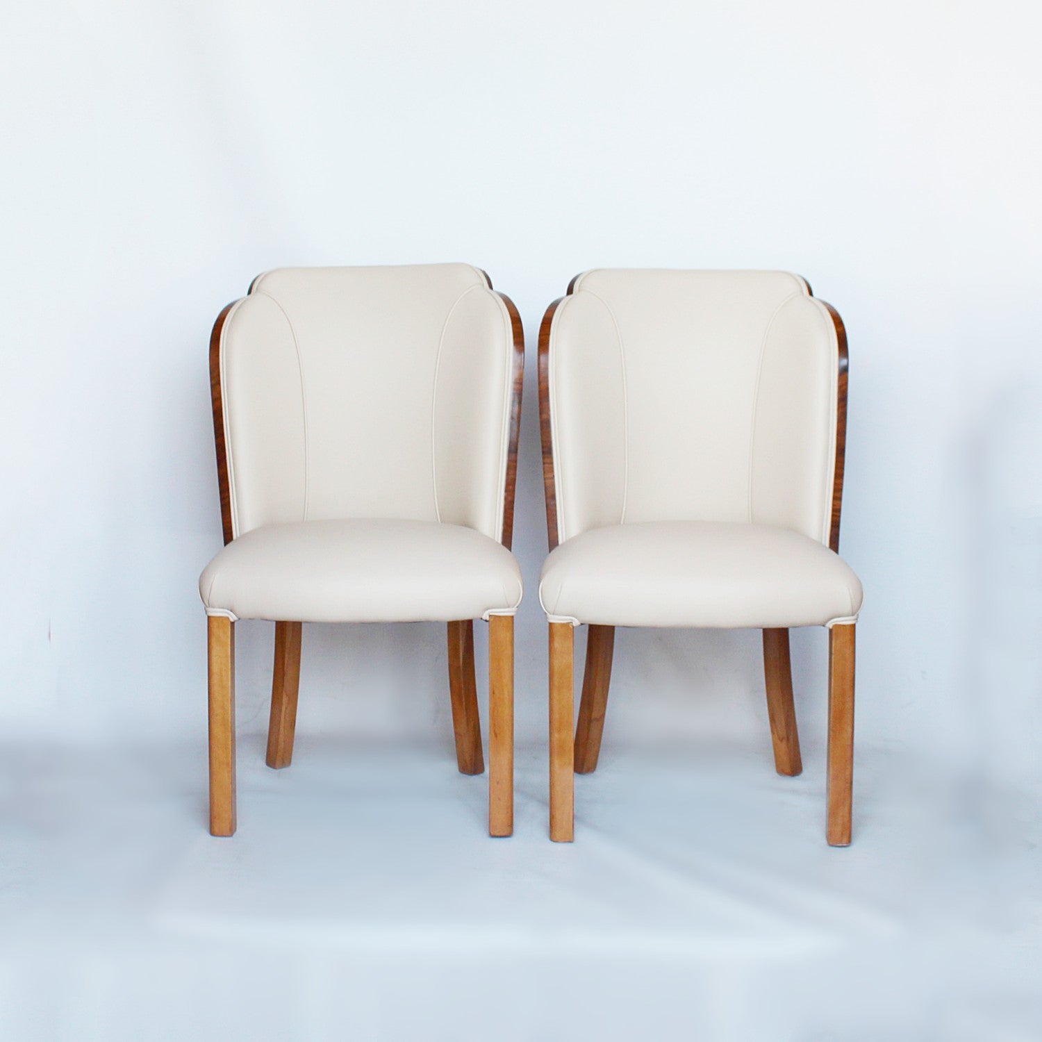 A pair of walnut backed, Art Deco cloud chairs by Harry & Lou Epstein at Jeroen Markies
