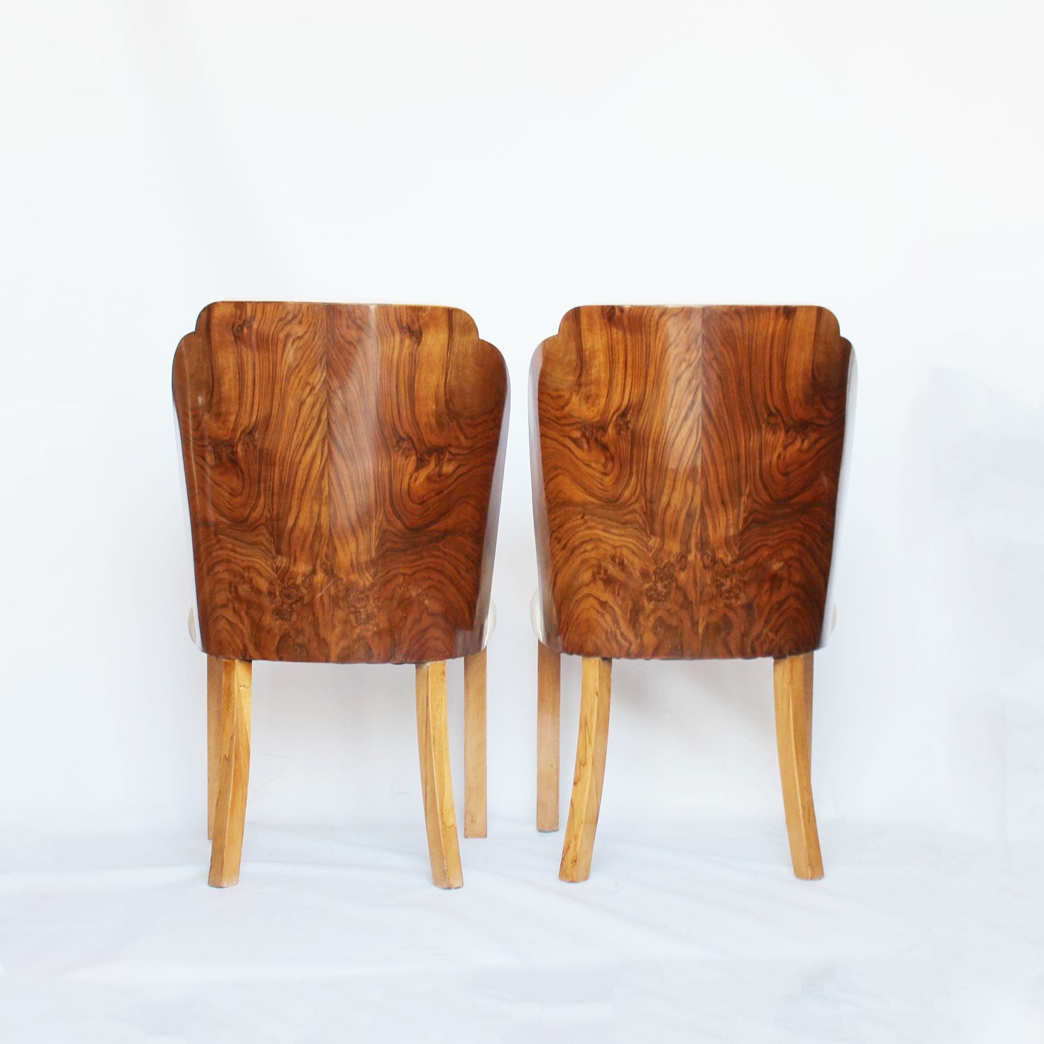 A pair of walnut backed, Art Deco cloud chairs by Harry & Lou Epstein at Jeroen Markies