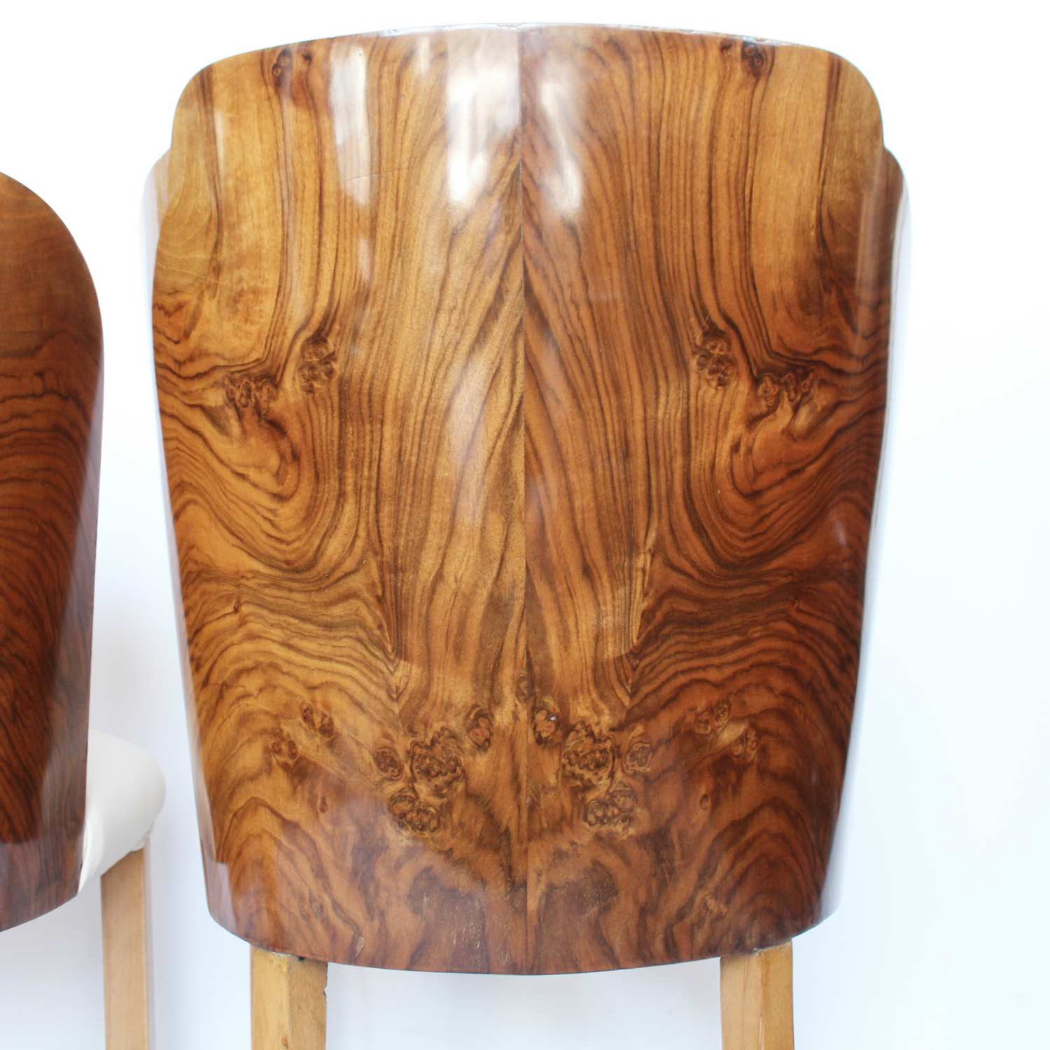 A pair of walnut backed, Art Deco cloud chairs by Harry & Lou Epstein at Jeroen Markies