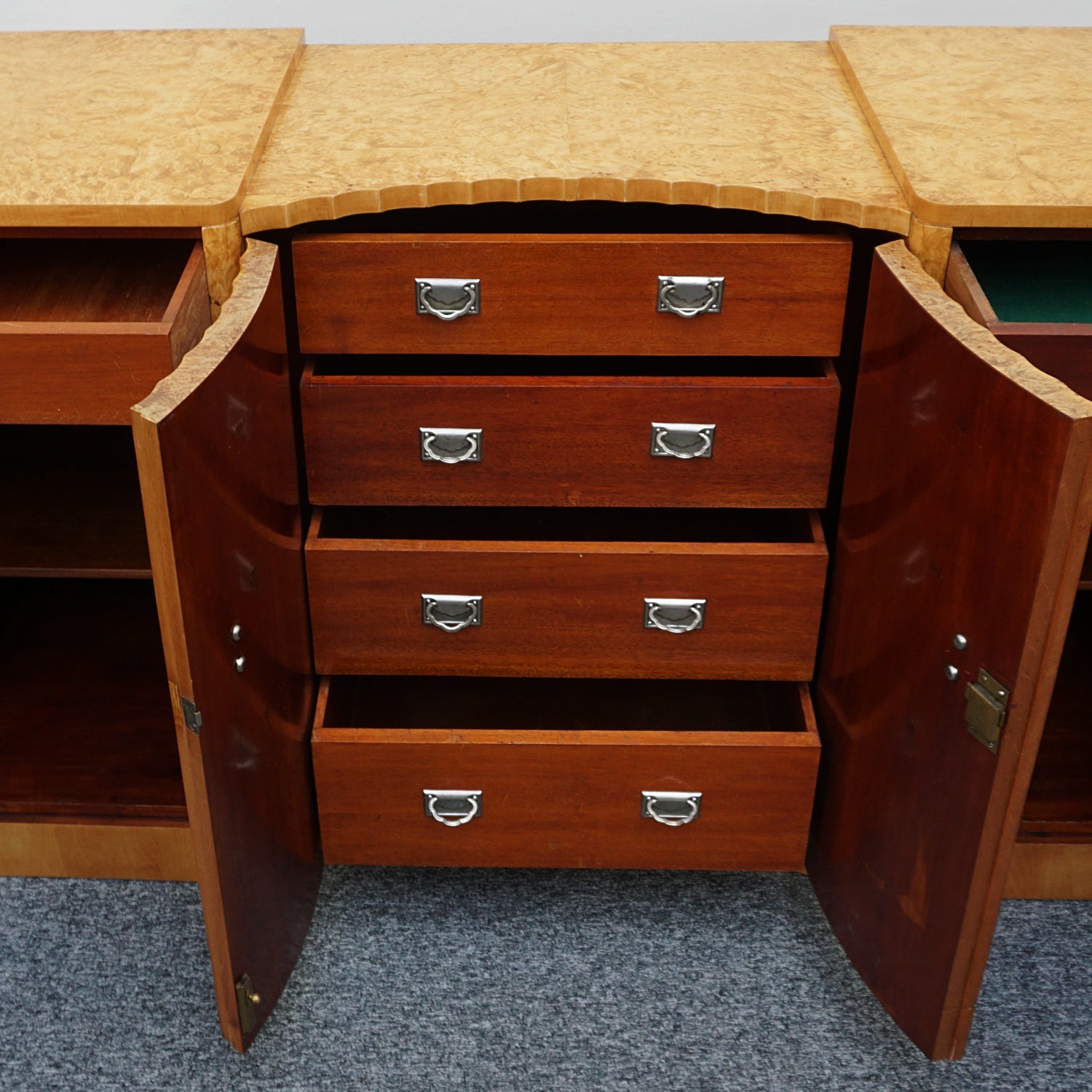 Art Deco Sideboard by Harry & Lou Epstein English Circa 1930 veneered in burr walnut with original bakelite handles. Vintage Art Deco - Jeroen Markies Art Deco