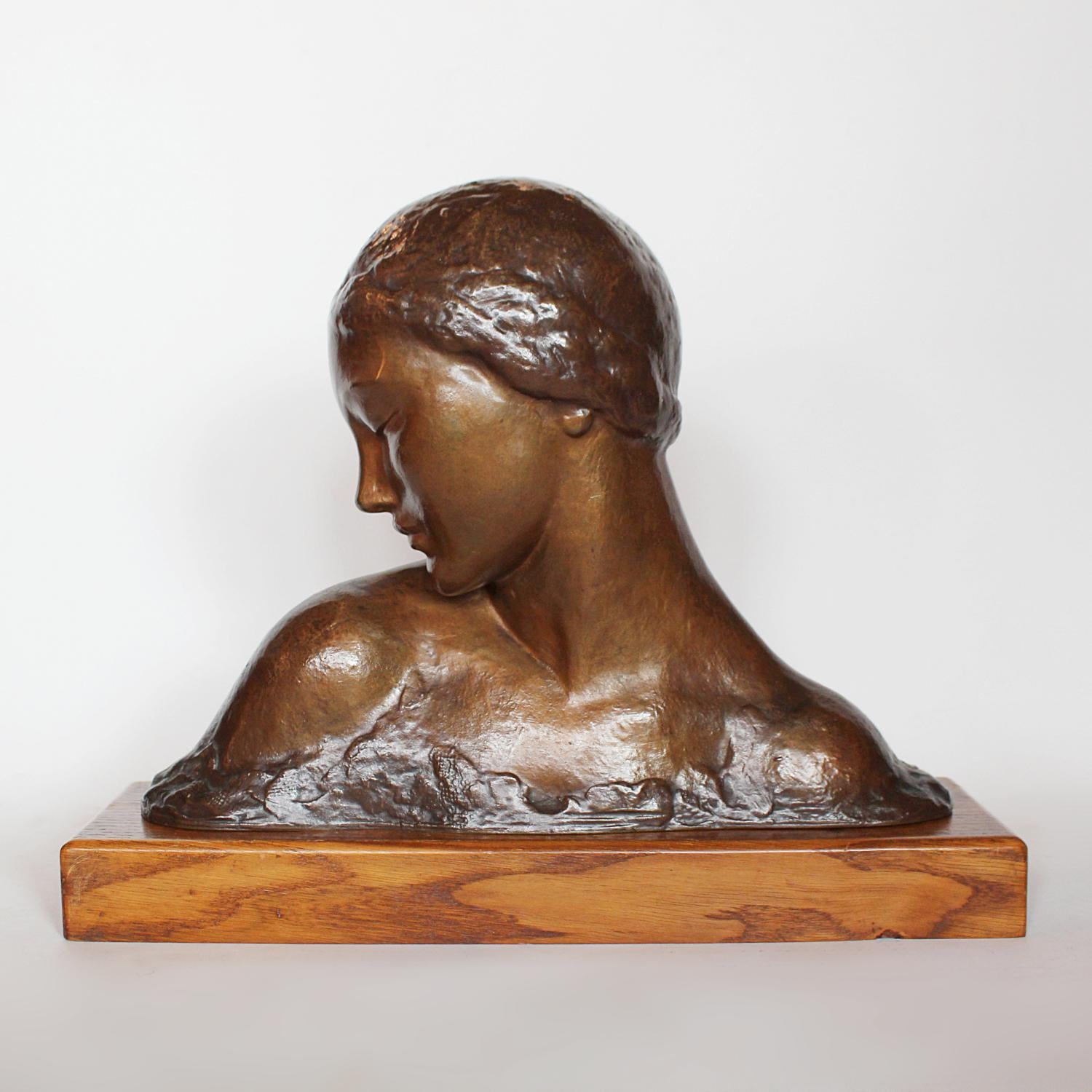 Amadeo Gennarelli Art Deco bronze bust of a young woman set over a wooden plinth at Jeroen Markies