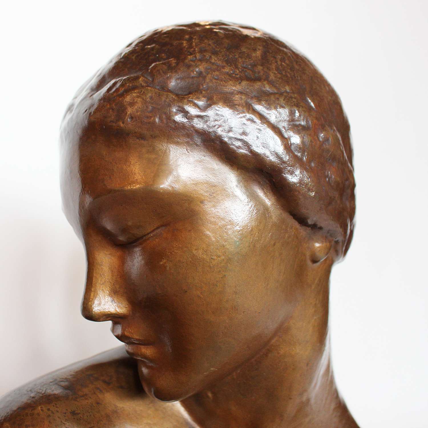 Amadeo Gennarelli Art Deco bronze bust of a young woman set over a wooden plinth at Jeroen Markies
