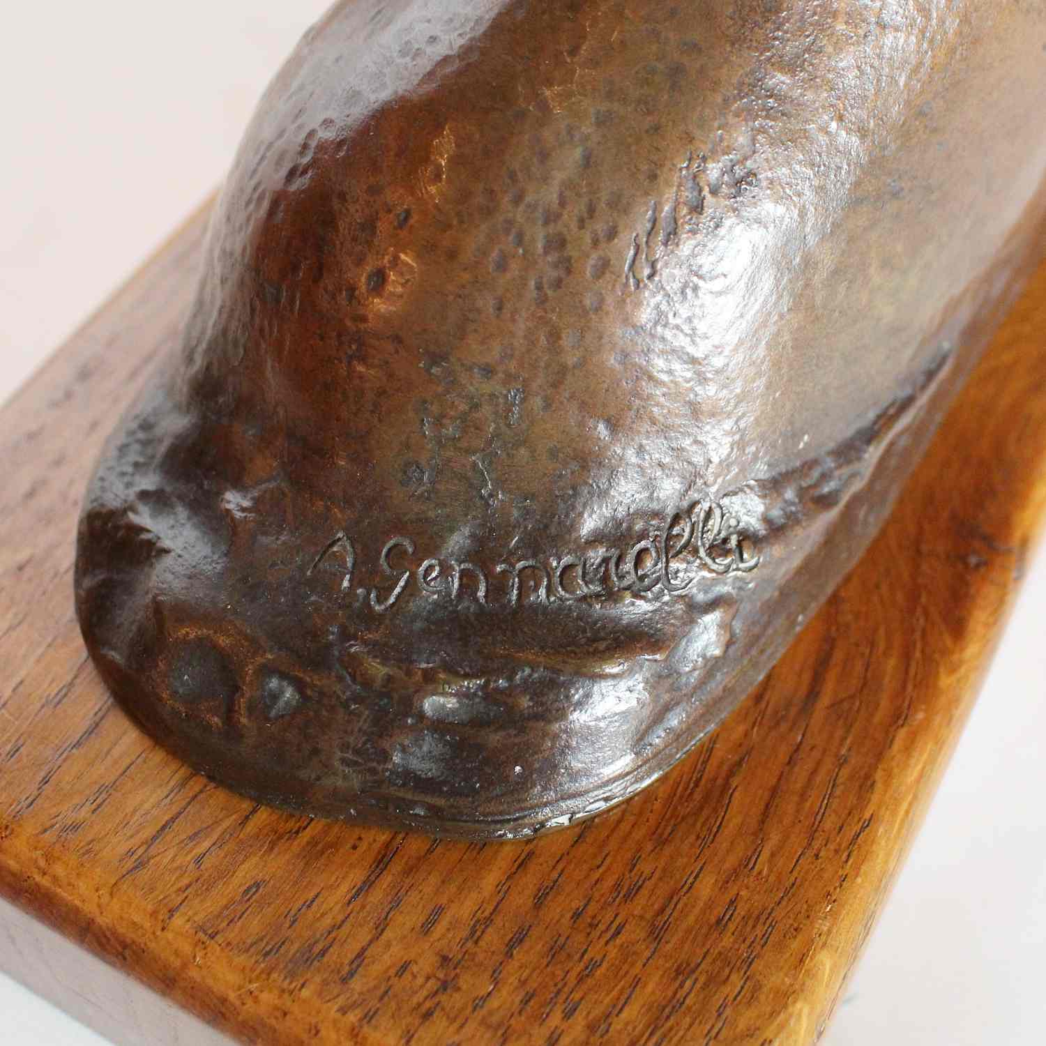 Amadeo Gennarelli Art Deco bronze bust of a young woman set over a wooden plinth at Jeroen Markies
