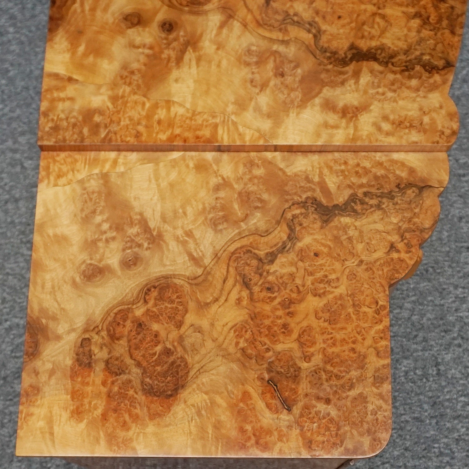 An Art Deco Sideboard by Harry & Lou Epstein with fluted sides set over a curved walnut base made of solid mahogany with burr walnut veneer