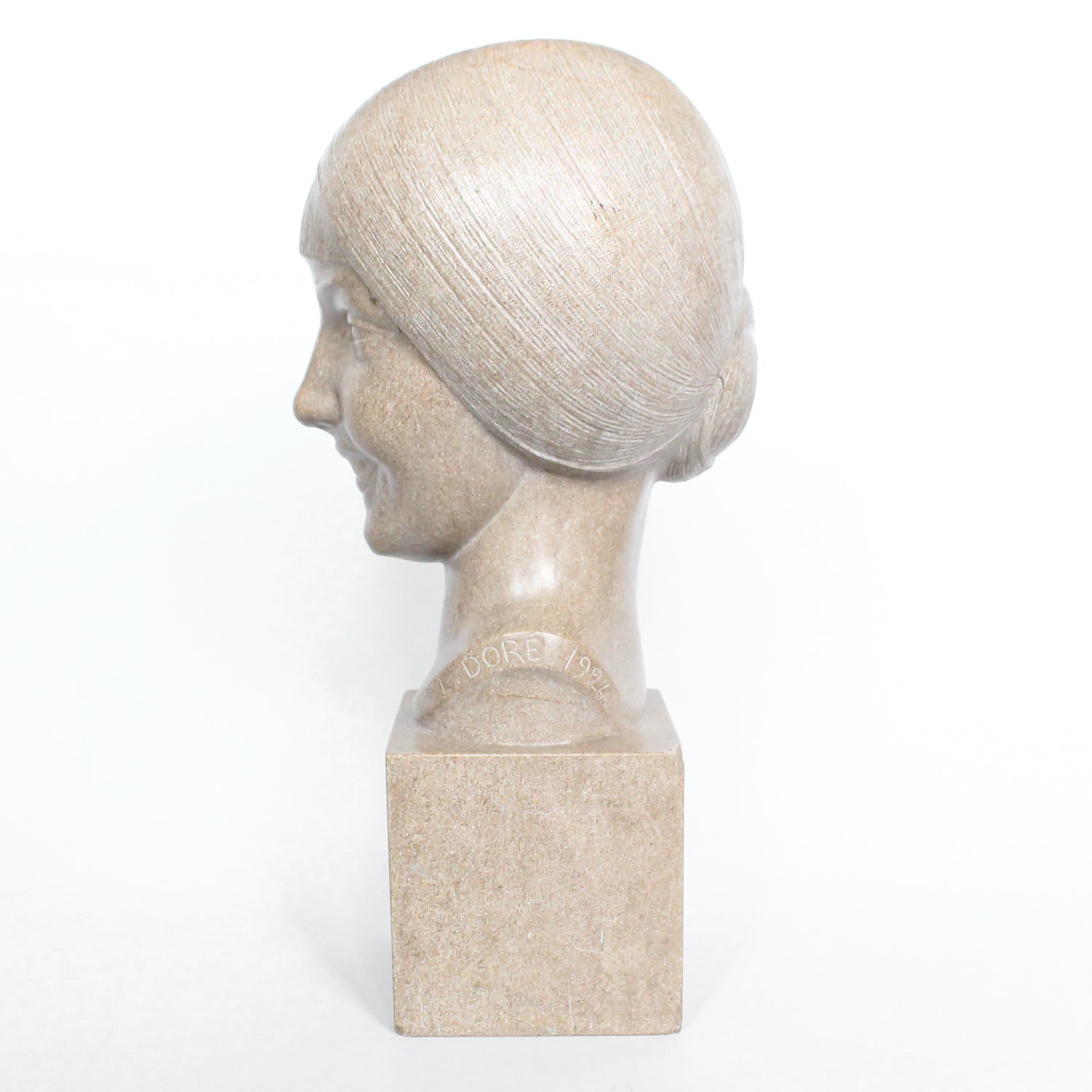 An Art Deco, stone carved sculpture of a smiling young lady, set over an integral plinth. Original dedication plaque to rear at Jeroen Markies.