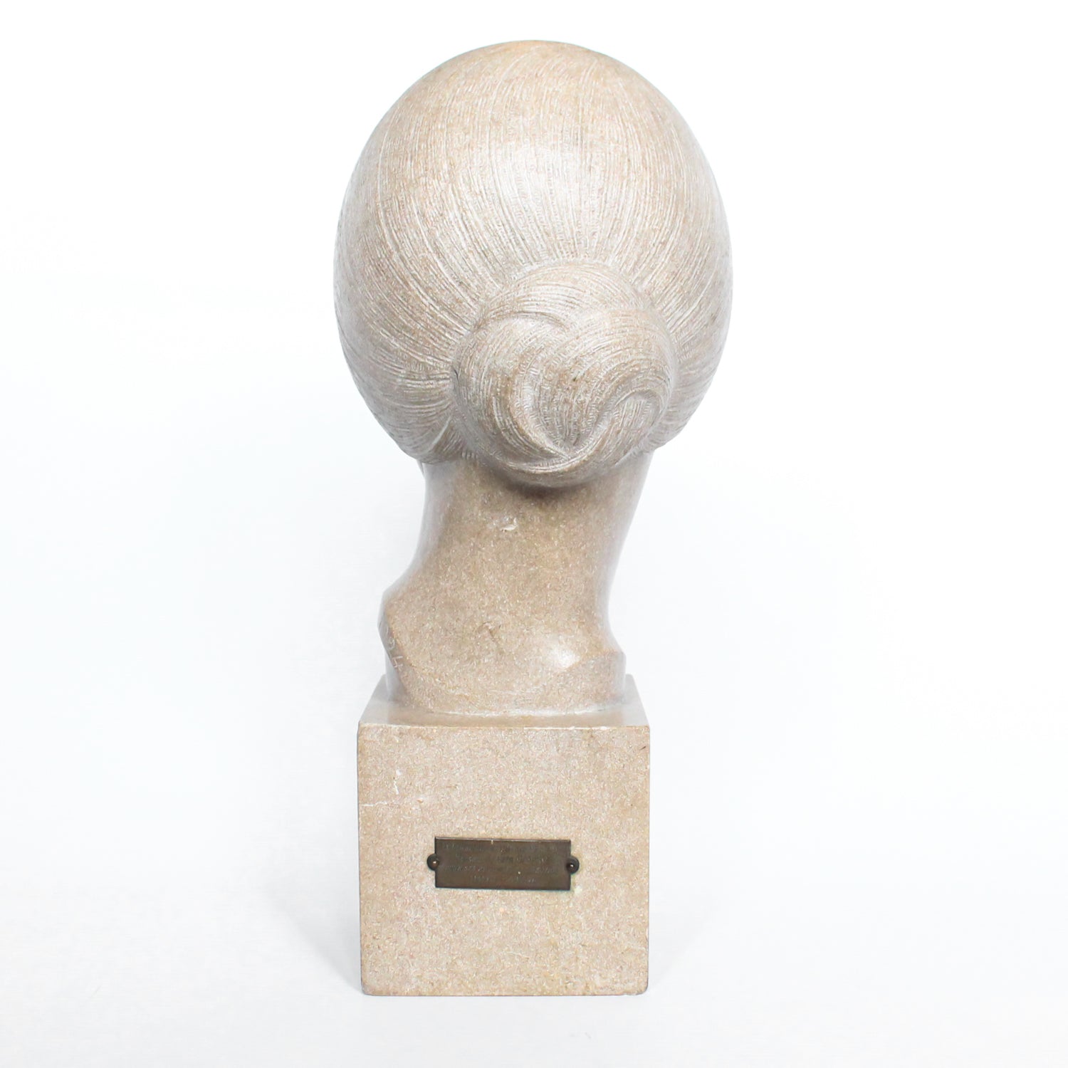 An Art Deco, stone carved sculpture of a smiling young lady, set over an integral plinth. Original dedication plaque to rear at Jeroen Markies.