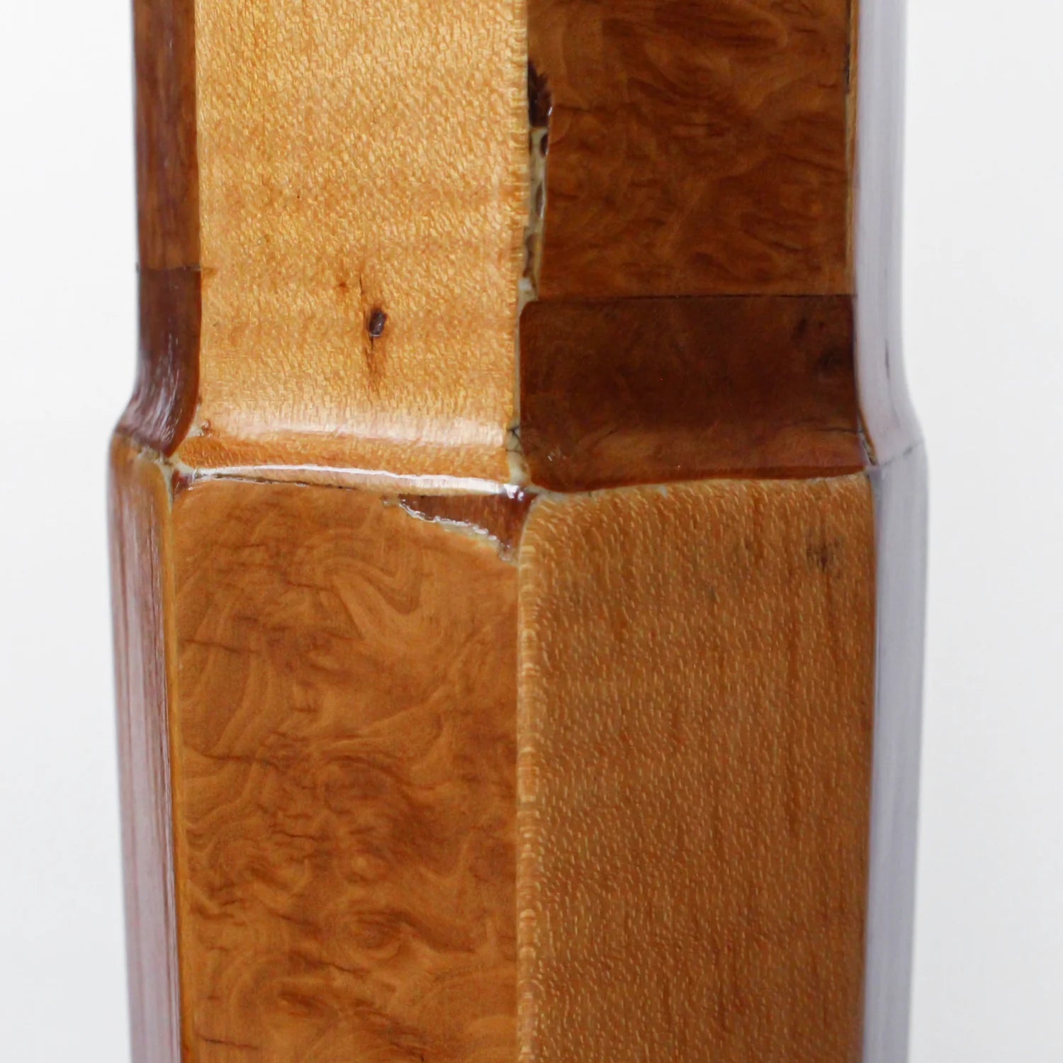 A pair of Art Deco uplighter floor lamps by Harry & Lou Epstein. Made of walnut and satin wood with domed copper shades.