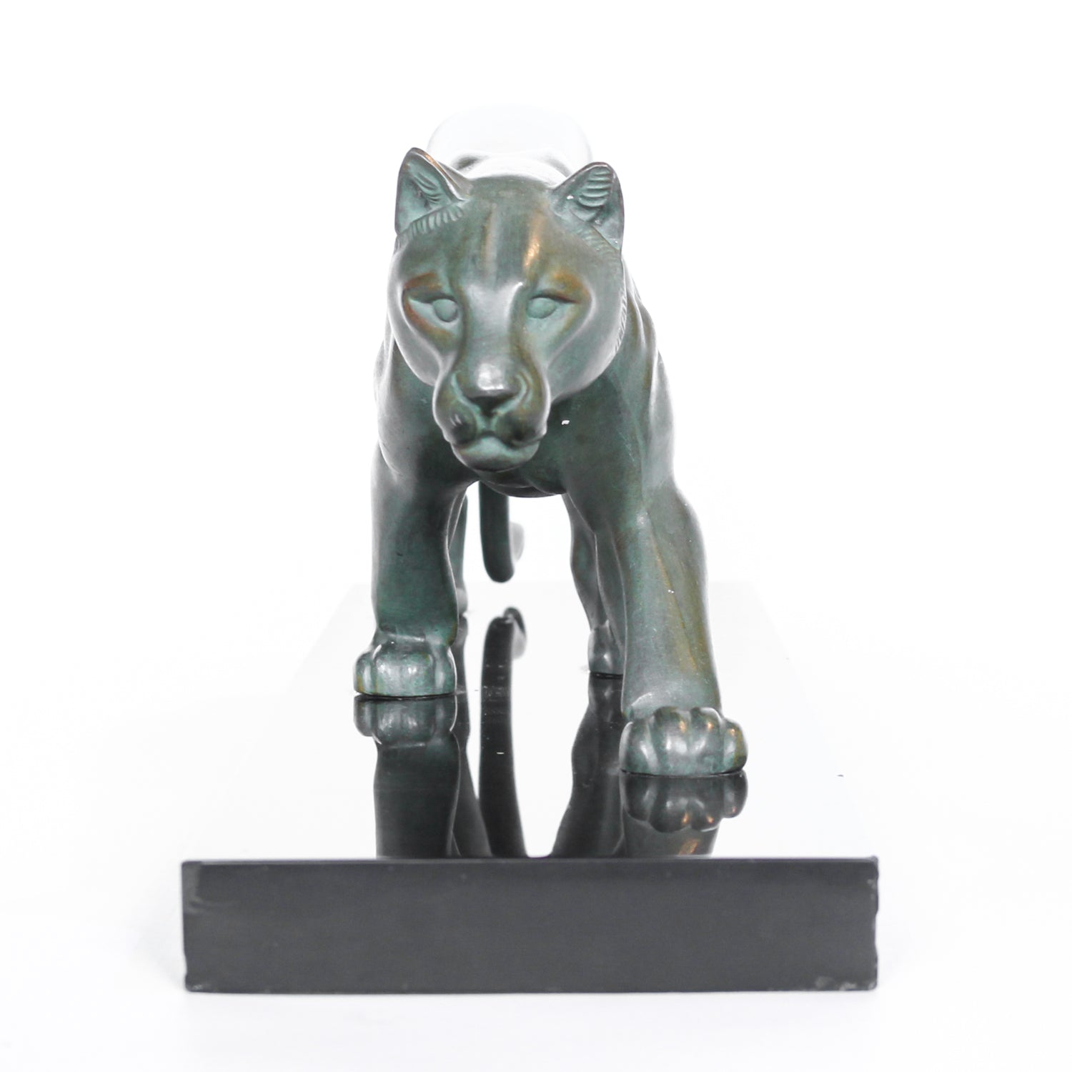 An Art Deco, patinated bronze study of a prowling lioness, mounted on a black marble base. Signed 'M. Leduc' at Jeroen Markies.