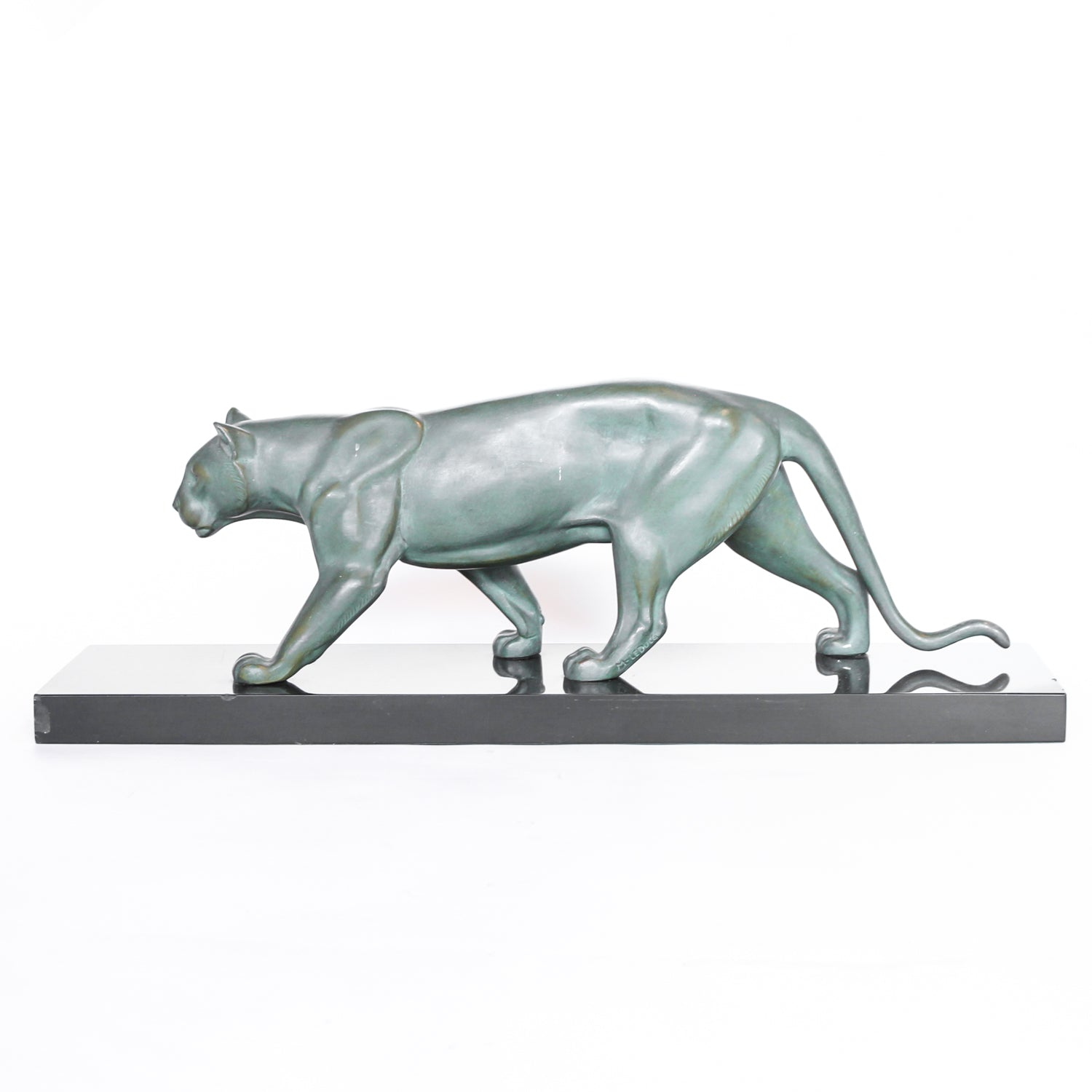 An Art Deco, patinated bronze study of a prowling lioness, mounted on a black marble base. Signed 'M. Leduc' at Jeroen Markies.
