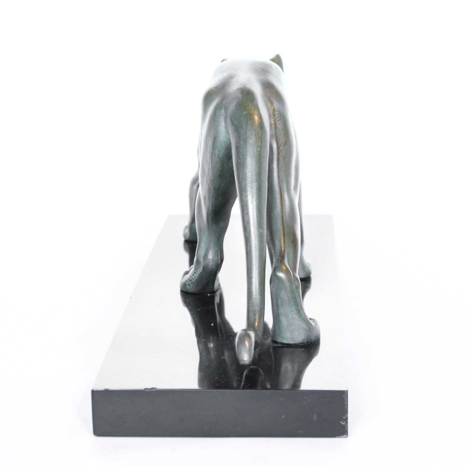 An Art Deco, patinated bronze study of a prowling lioness, mounted on a black marble base. Signed 'M. Leduc' at Jeroen Markies.