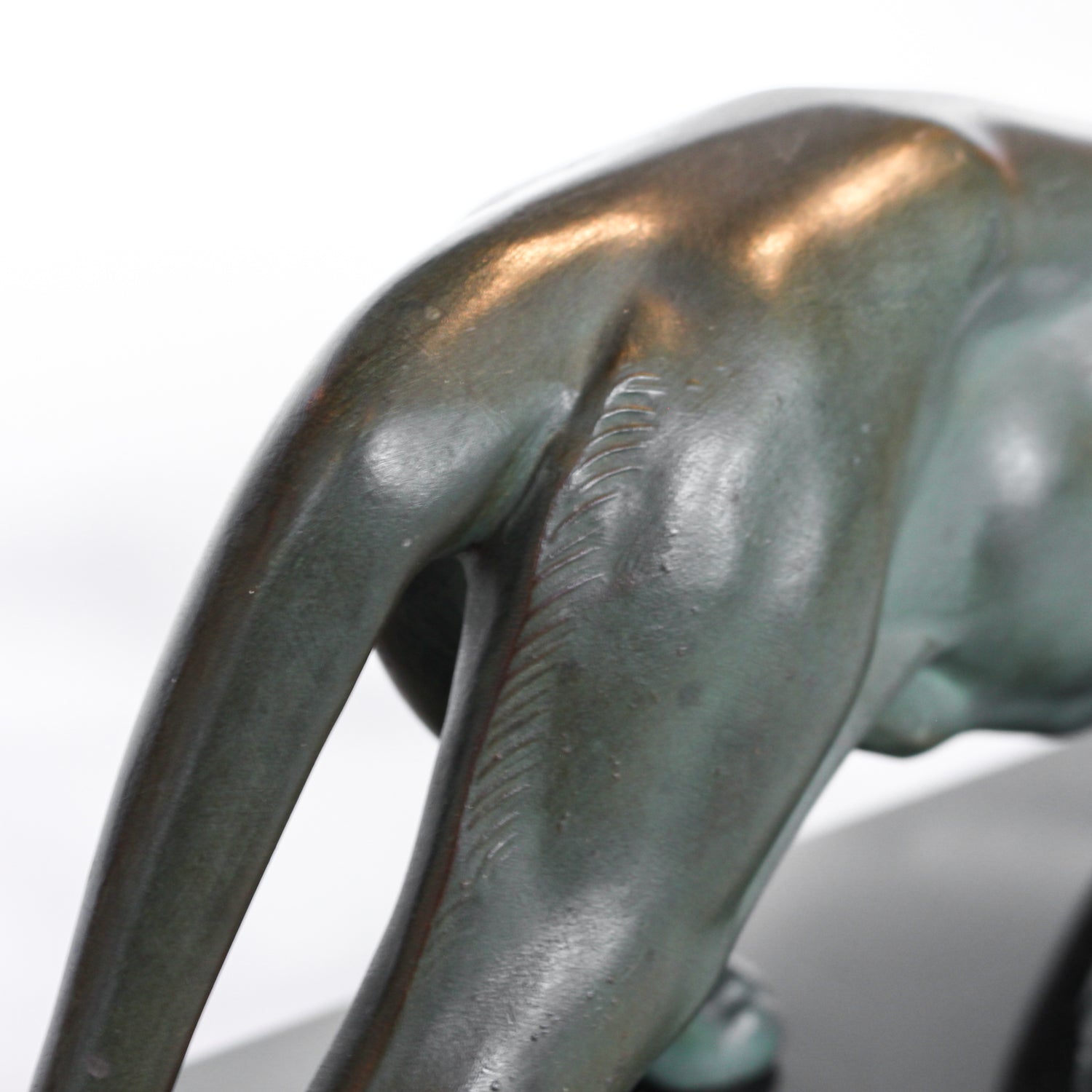 An Art Deco, patinated bronze study of a prowling lioness, mounted on a black marble base. Signed 'M. Leduc' at Jeroen Markies.