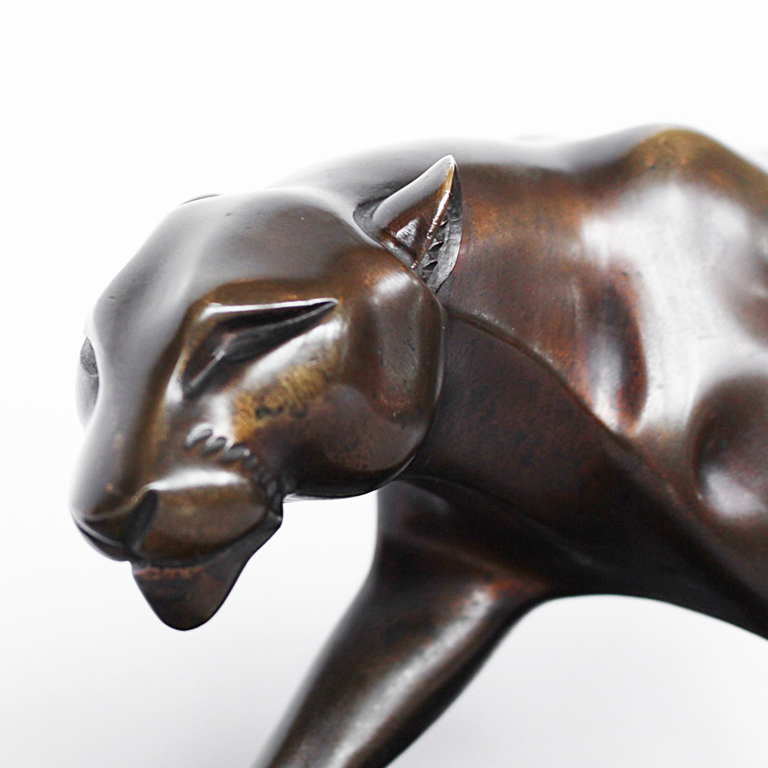 An Art Deco, patinated bronze study of a prowling panther, set over an integral marble base. Signed H Molins to marble and cast and stamped with foundry mark to cast at Jeroen Markies