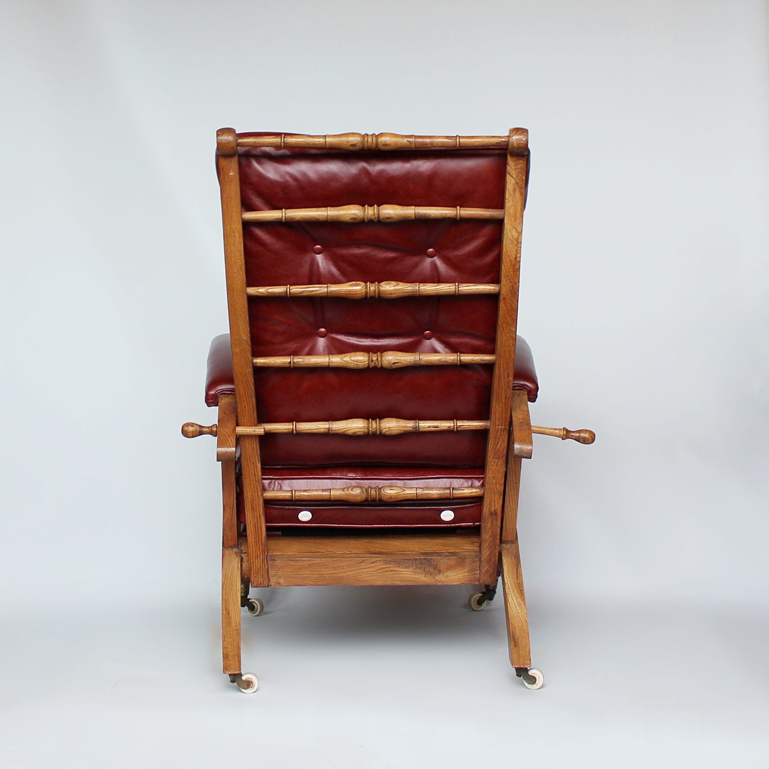 A pair of Philip Webb Arts & Crafts reclining armchairs circa 1900