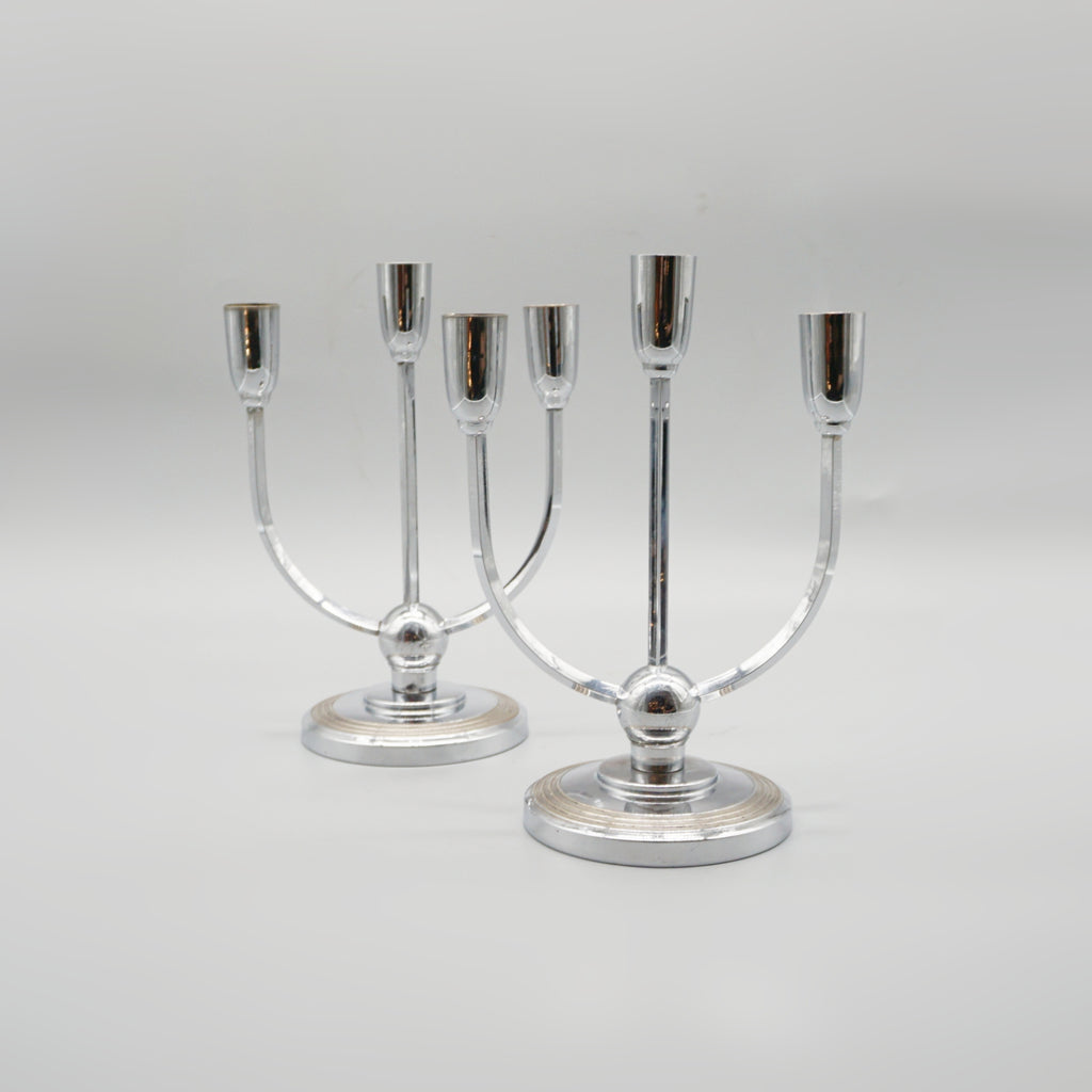 A pair of Mid-century chromed metal candelabrums&nbsp; set over a circular base - Jeroen Markies Art Deco 