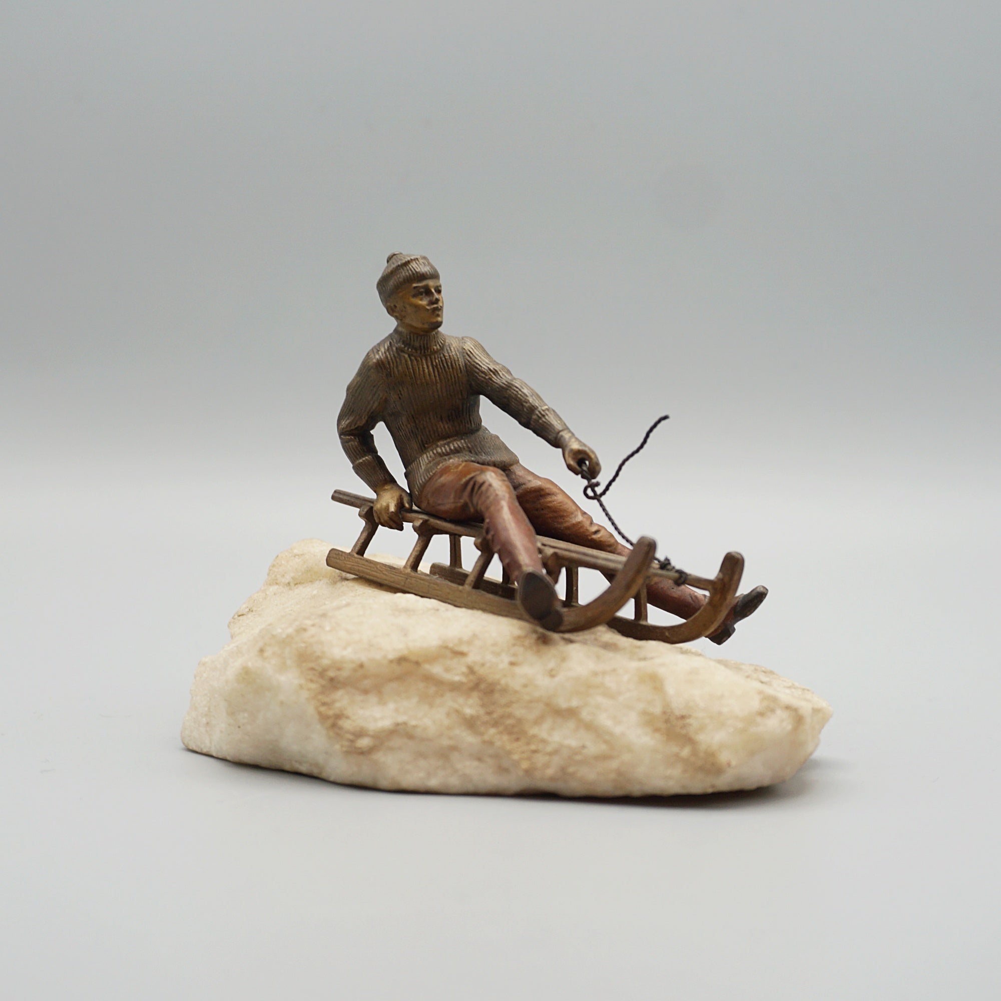 Franz Bergman Bronze Figure of a Man Riding a Sledge