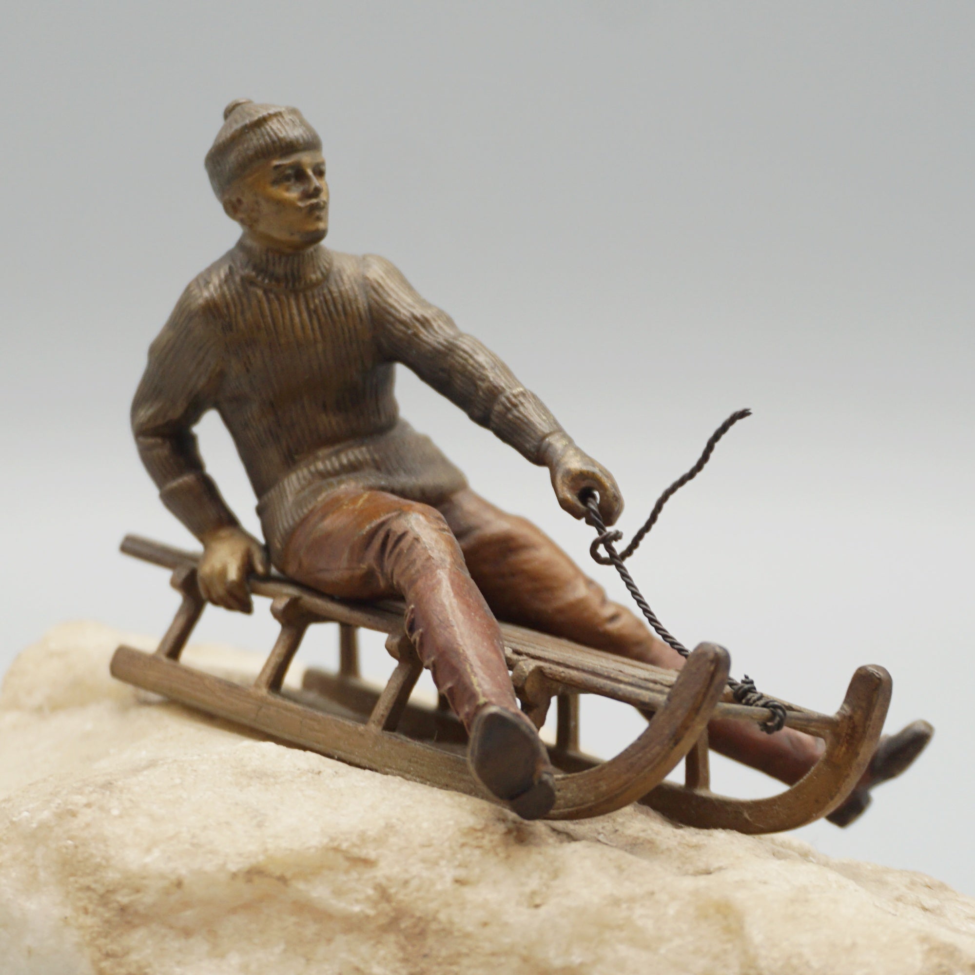 Franz Bergman Bronze Figure of a Man Riding a Sledge