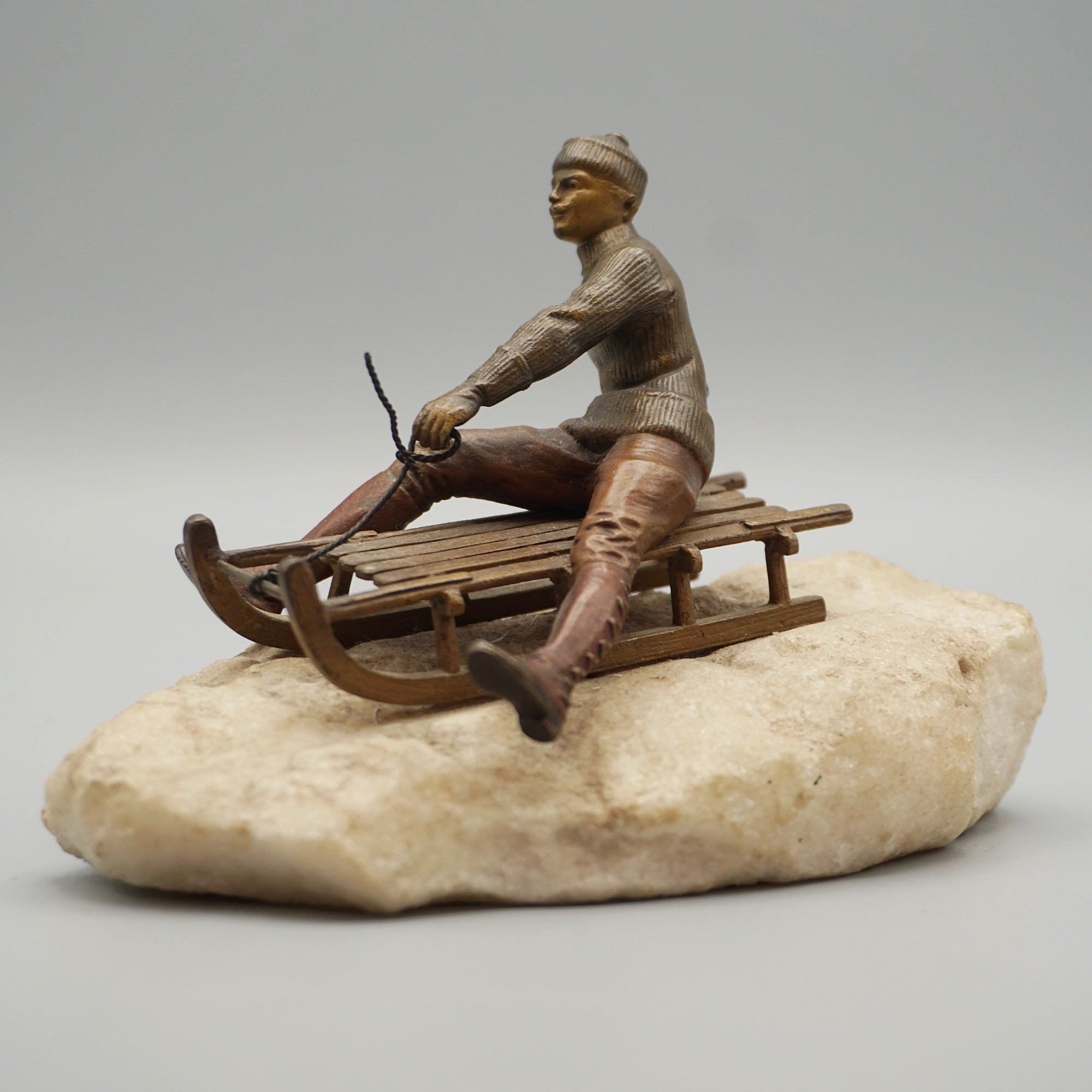 Franz Bergman Bronze Figure of a Man Riding a Sledge