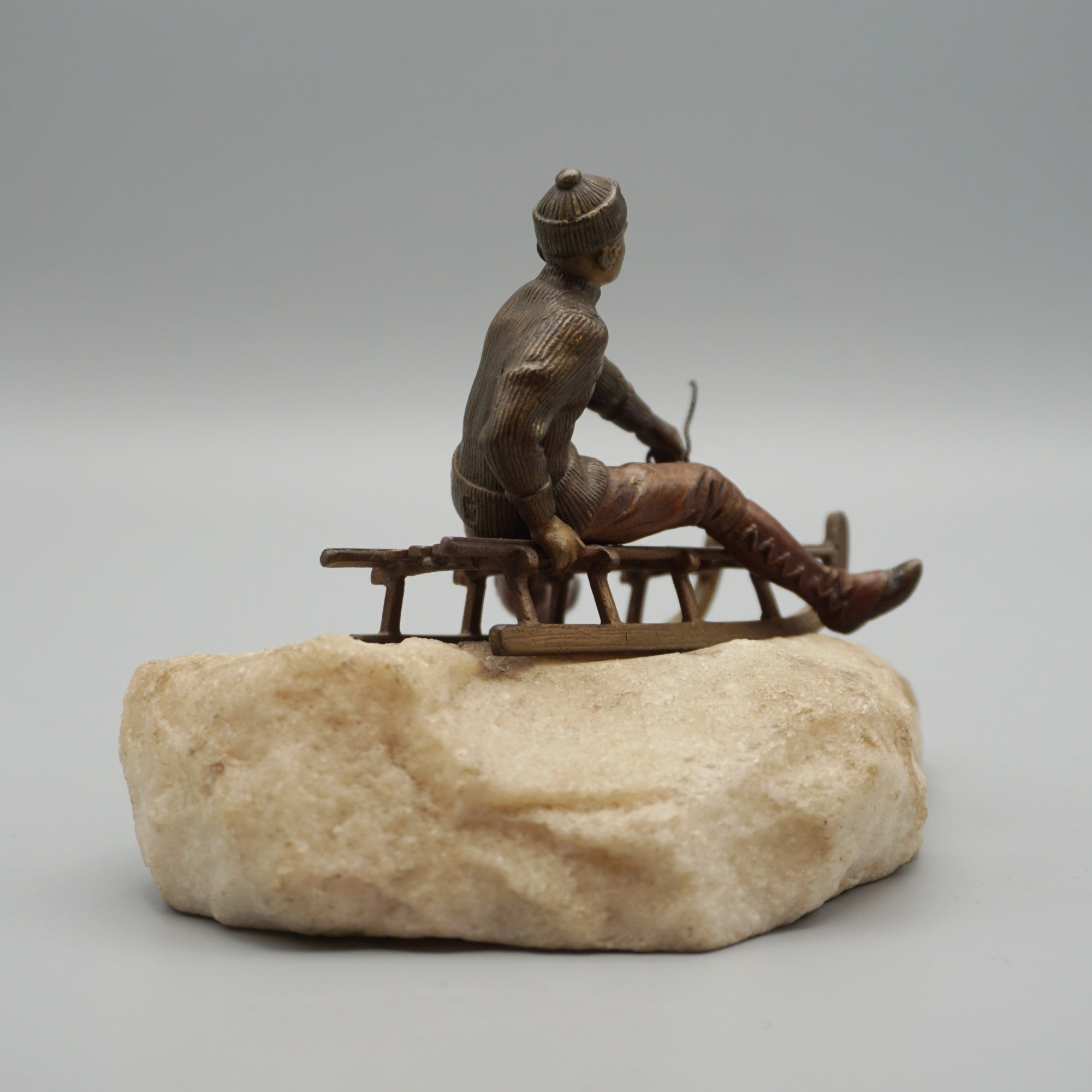 Franz Bergman Bronze Figure of a Man Riding a Sledge