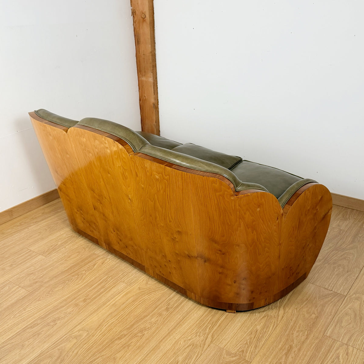 Stunning Art Deco Cloud Sofa with Burr Ash Wraparound Veneers and Green Leather Re-upholstery | Markies Antiques Ltd 