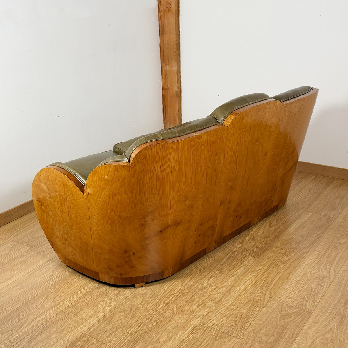 Stunning Art Deco Cloud Sofa with Burr Ash Wraparound Veneers and Green Leather Re-upholstery | Markies Antiques Ltd 