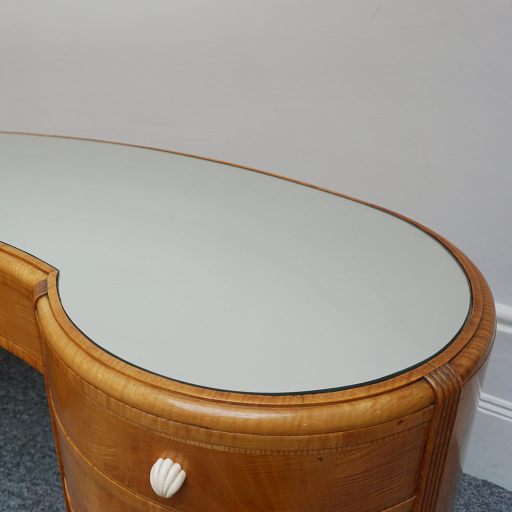 An Art Deco Desk by Betty Joel. Satin birch veneered with macassar ebony banding to base. Glass mirrored top with original ivory hand carved shell handles. 1930 dressing table, art deco desk - Jeroen Markies Art Deco