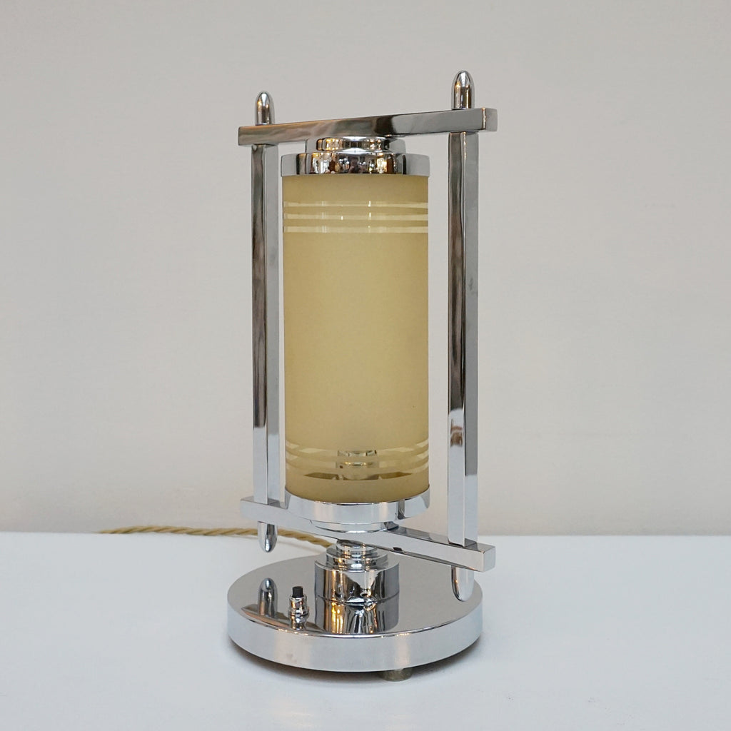 Squared chrome frame with cylindrical yellow glass inner shade. 