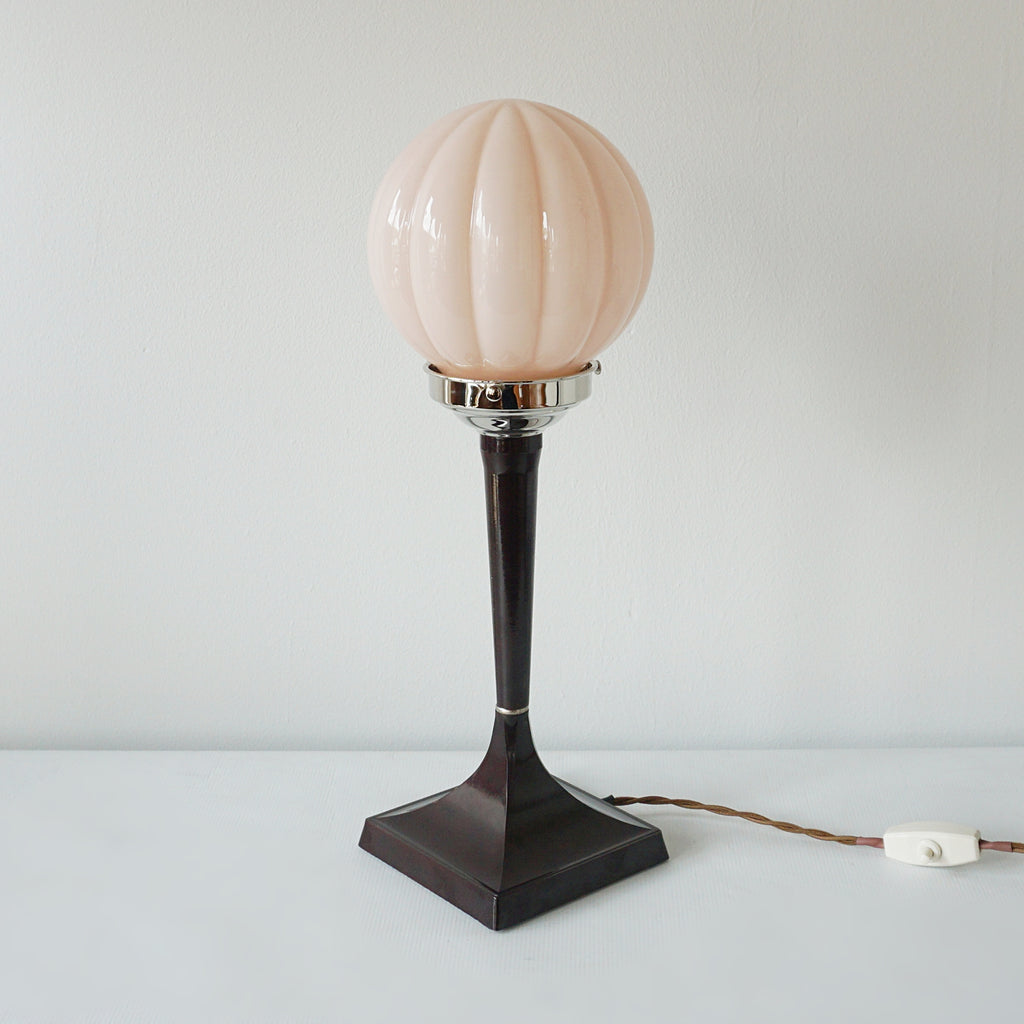 An Art Deco style table lamp. Brown bakelite square stem with peach pink glass globe shade - Jeroen Markies Art Deco