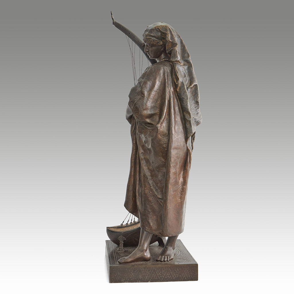 Late 19th Century Bronze. Spelter and enamel with cream yellow patination. Harp playing figure. - Jeroen Markies Art Deco
