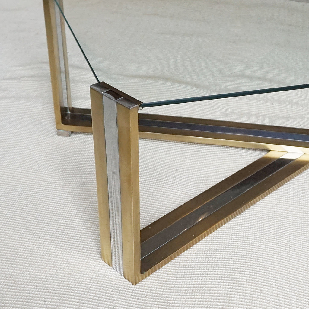A Mid-Century coffee table designed by Romeo Rega. Brass and chrome X-frame base with inset glass top - Jereon Markies Art Deco