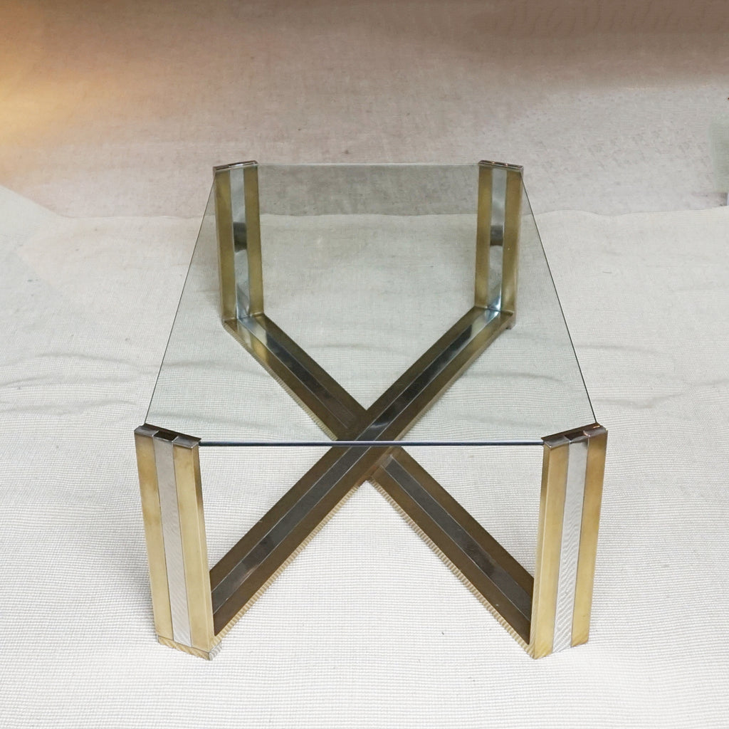 A Mid-Century coffee table designed by Romeo Rega. Brass and chrome X-frame base with inset glass top - Jereon Markies Art Deco