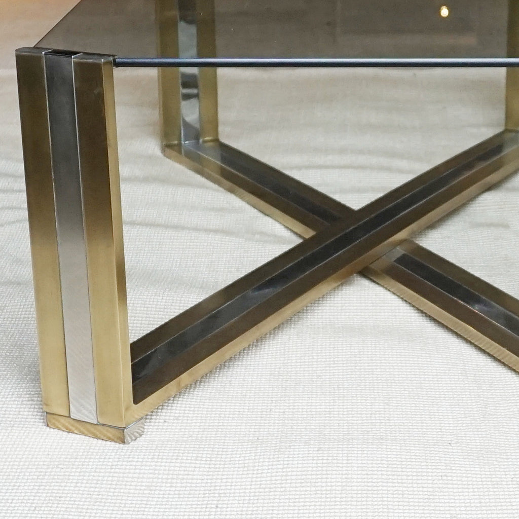 A Mid-Century coffee table designed by Romeo Rega. Brass and chrome X-frame base with inset glass top - Jereon Markies Art Deco