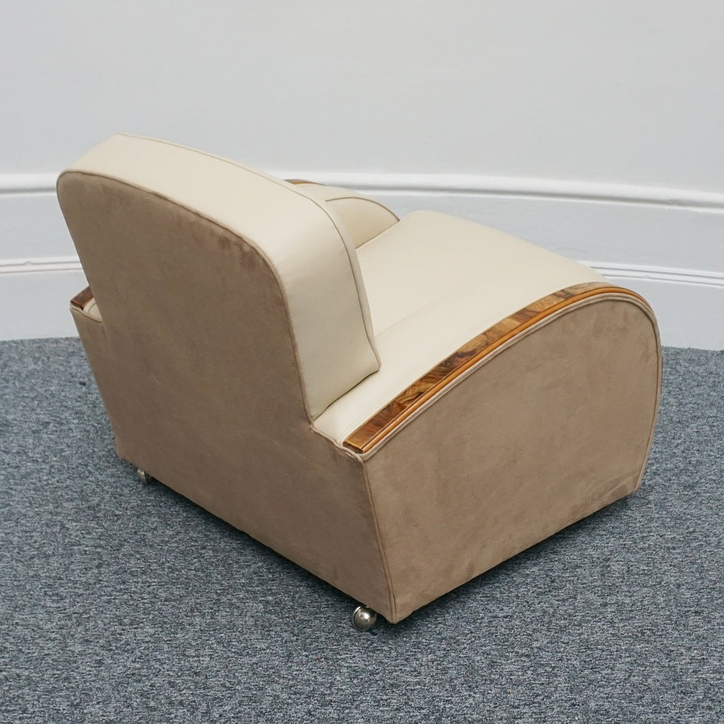An Art Deco tank chairs by Heals of london. Made of Burr and solid walnut banding with reeded lower section, Upholstered in cream leather and contrasting faux suede