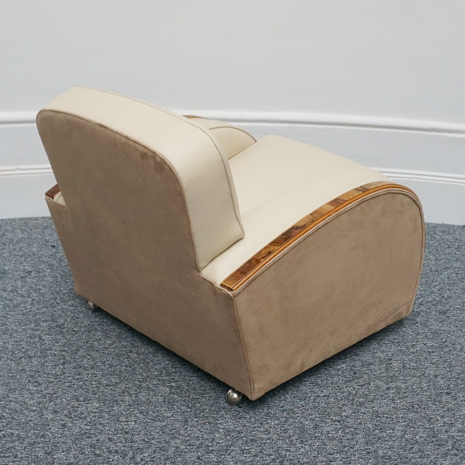 An Art Deco tank chairs by Heals of london. Made of Burr and solid walnut banding with reeded lower section, Upholstered in cream leather and contrasting faux suede
