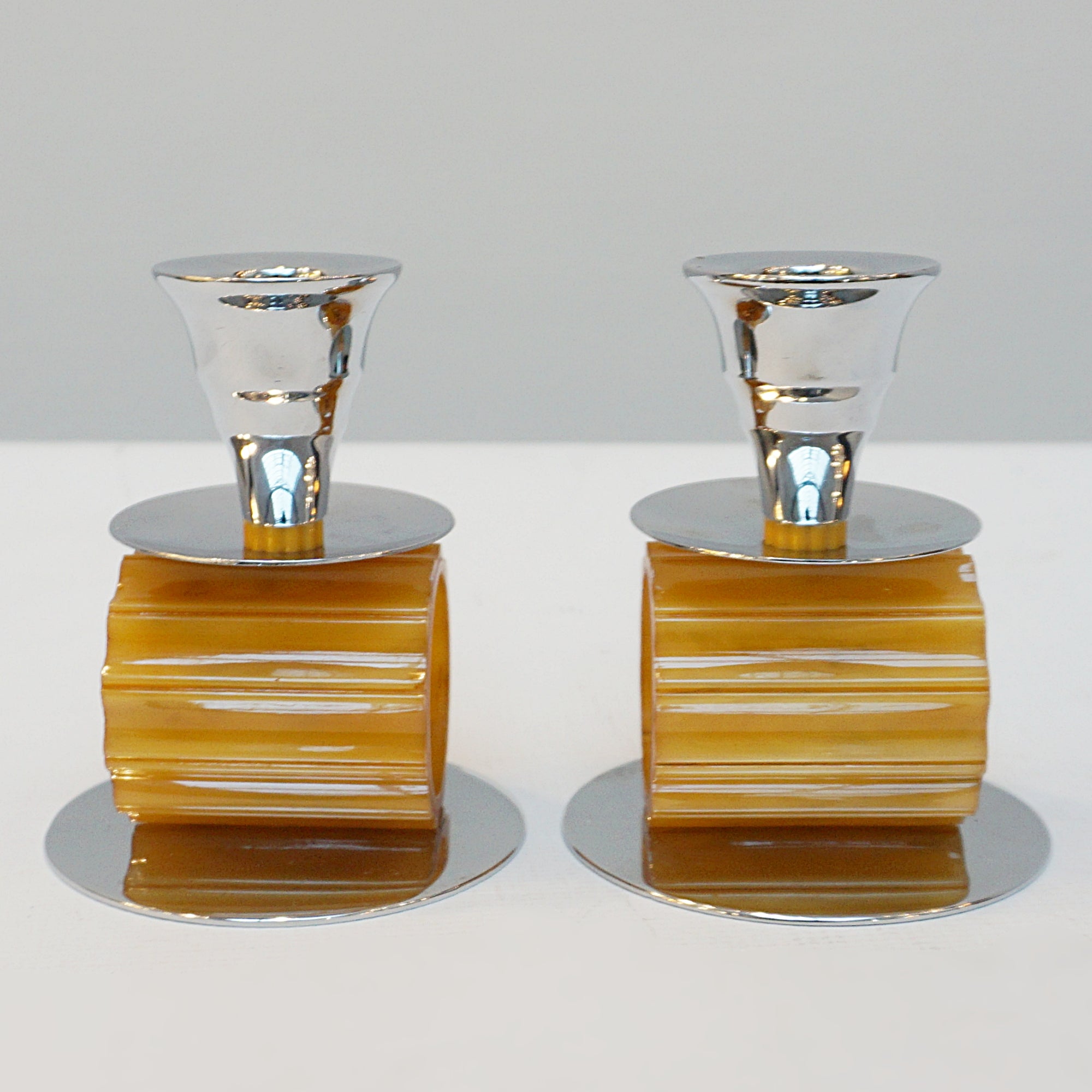 A pair of Art Deco style candlesticks. Amber bakelite, chrome. Jeroen Markies Art Deco
