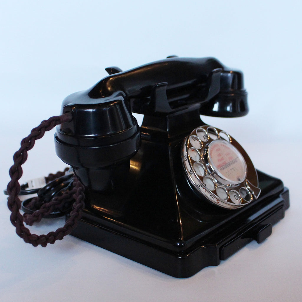 An original GPO telephone in black bakelite. With integral drawer at Jeroen Markies.