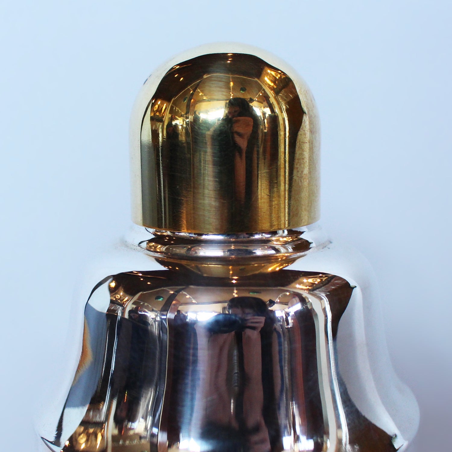 An Art Deco, silver plated and gilt recipe cocktail shaker. Integral strainer. Outer  sliver plated cover revealing brass underlayer with ingredients for various cocktails. Stamped 'Napier' to underside at Jeroen Markies.