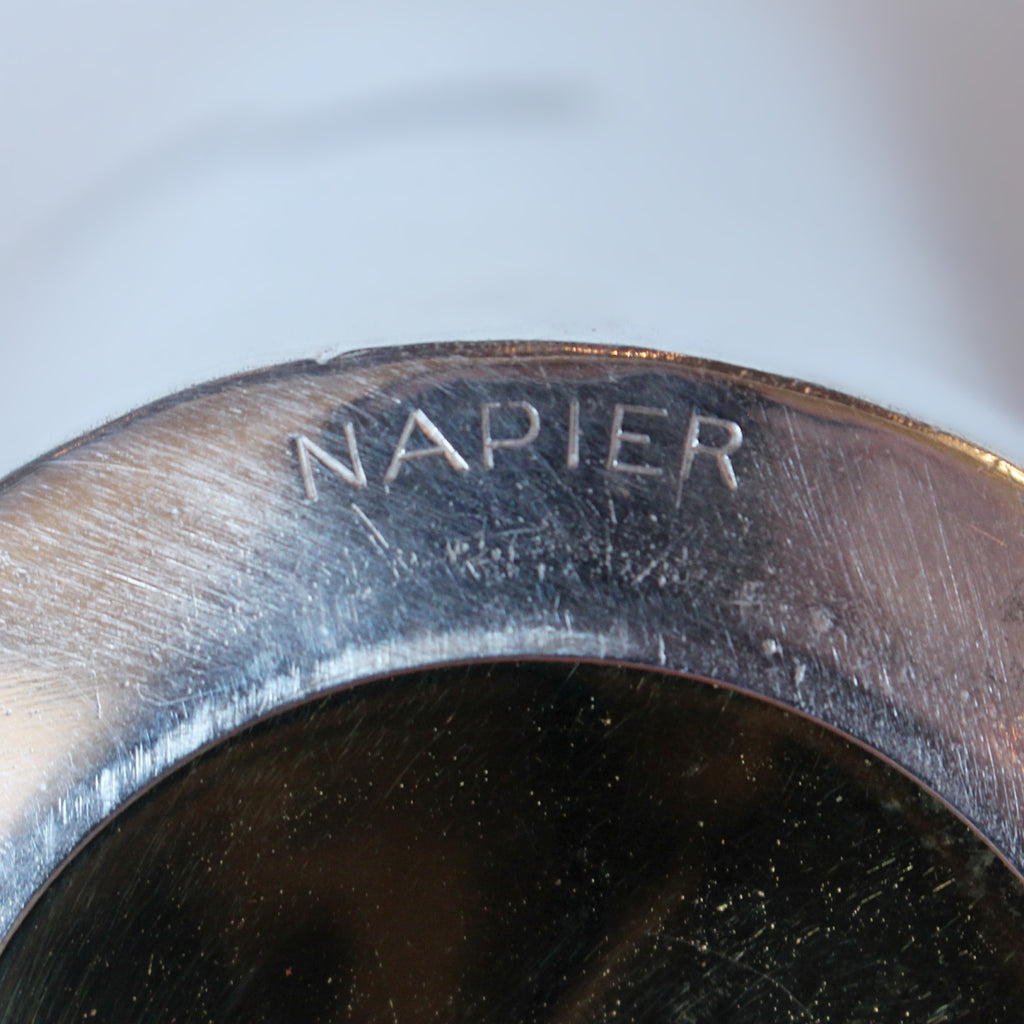 An Art Deco, silver plated and gilt recipe cocktail shaker. Integral strainer. Outer  sliver plated cover revealing brass underlayer with ingredients for various cocktails. Stamped 'Napier' to underside at Jeroen Markies.