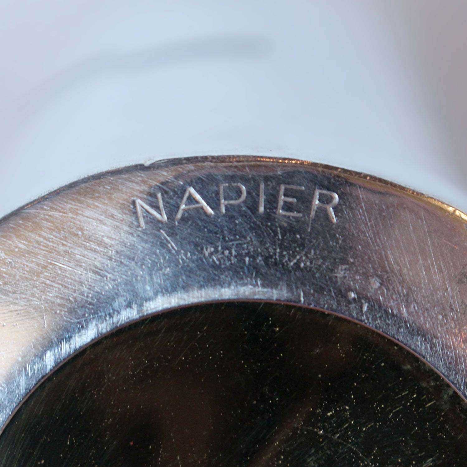 An Art Deco, silver plated and gilt recipe cocktail shaker. Integral strainer. Outer  sliver plated cover revealing brass underlayer with ingredients for various cocktails. Stamped 'Napier' to underside at Jeroen Markies.
