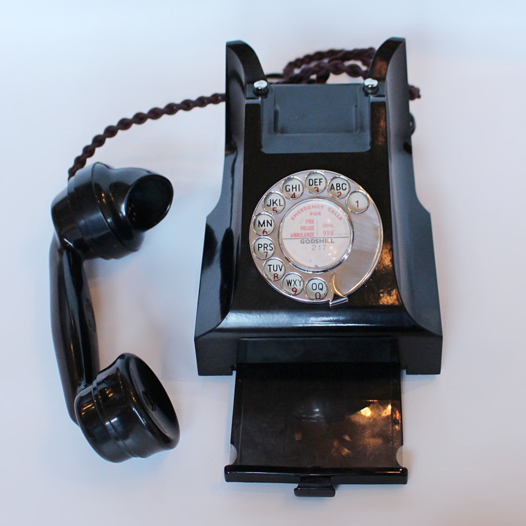An original GPO telephone in black bakelite. With integral drawer.
