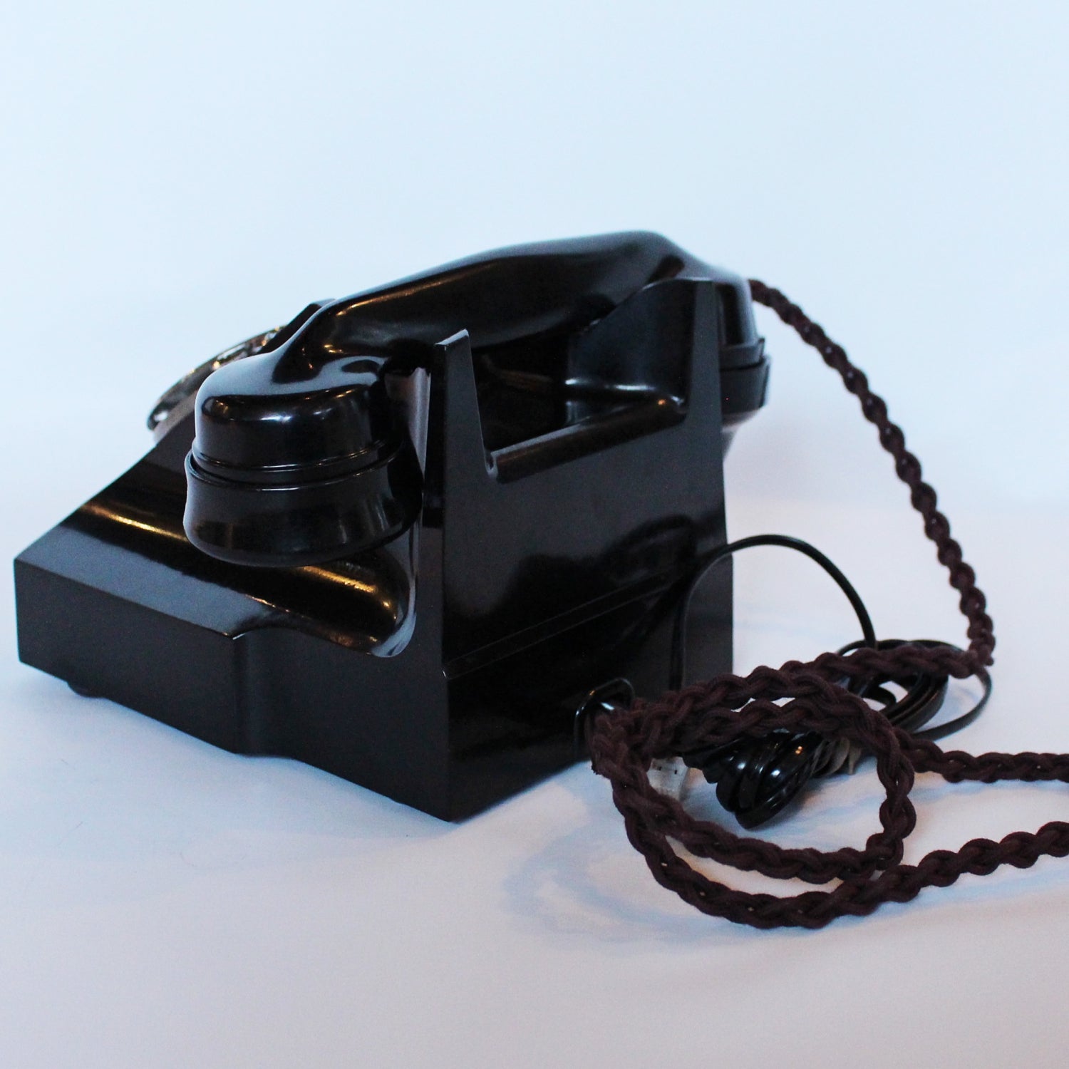 An original GPO telephone in black bakelite. With integral drawer.