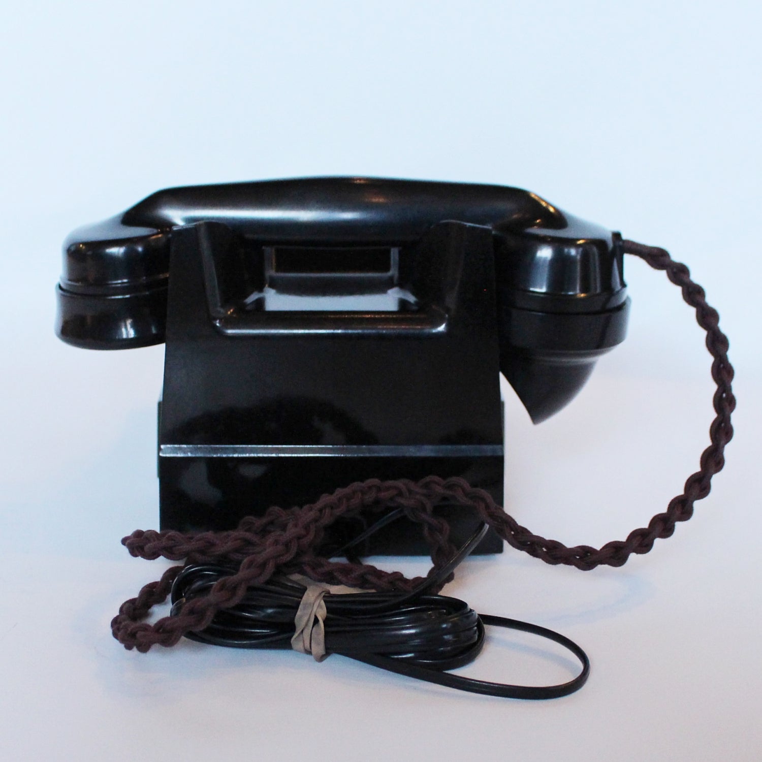 An original GPO telephone in black bakelite. With integral drawer.